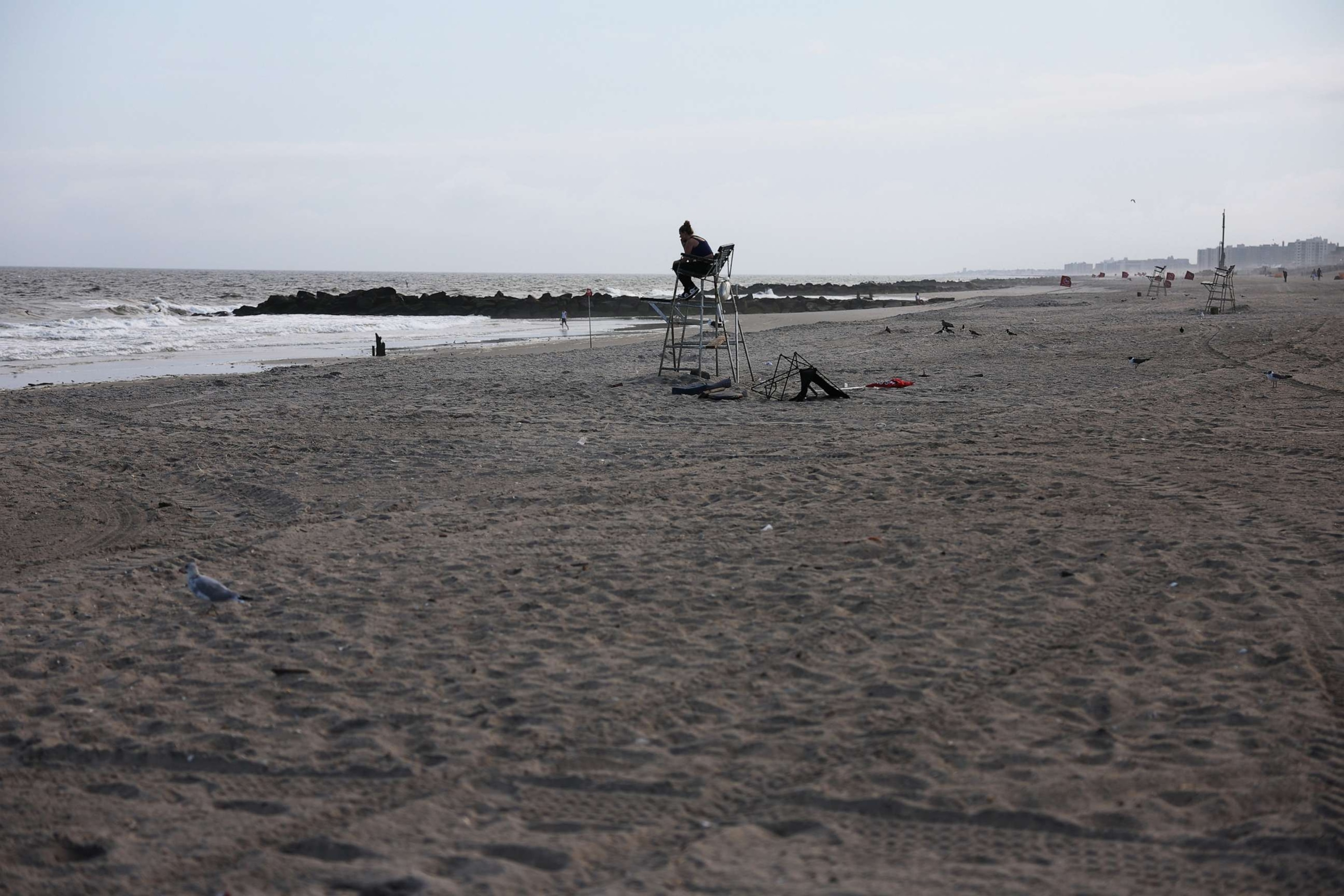 PHOTO: A stretch of beach stands empty along Rockaway Beach at 59th Street after a woman was attacked by a shark in the early evening on Aug. 7, 2023 in New York City.