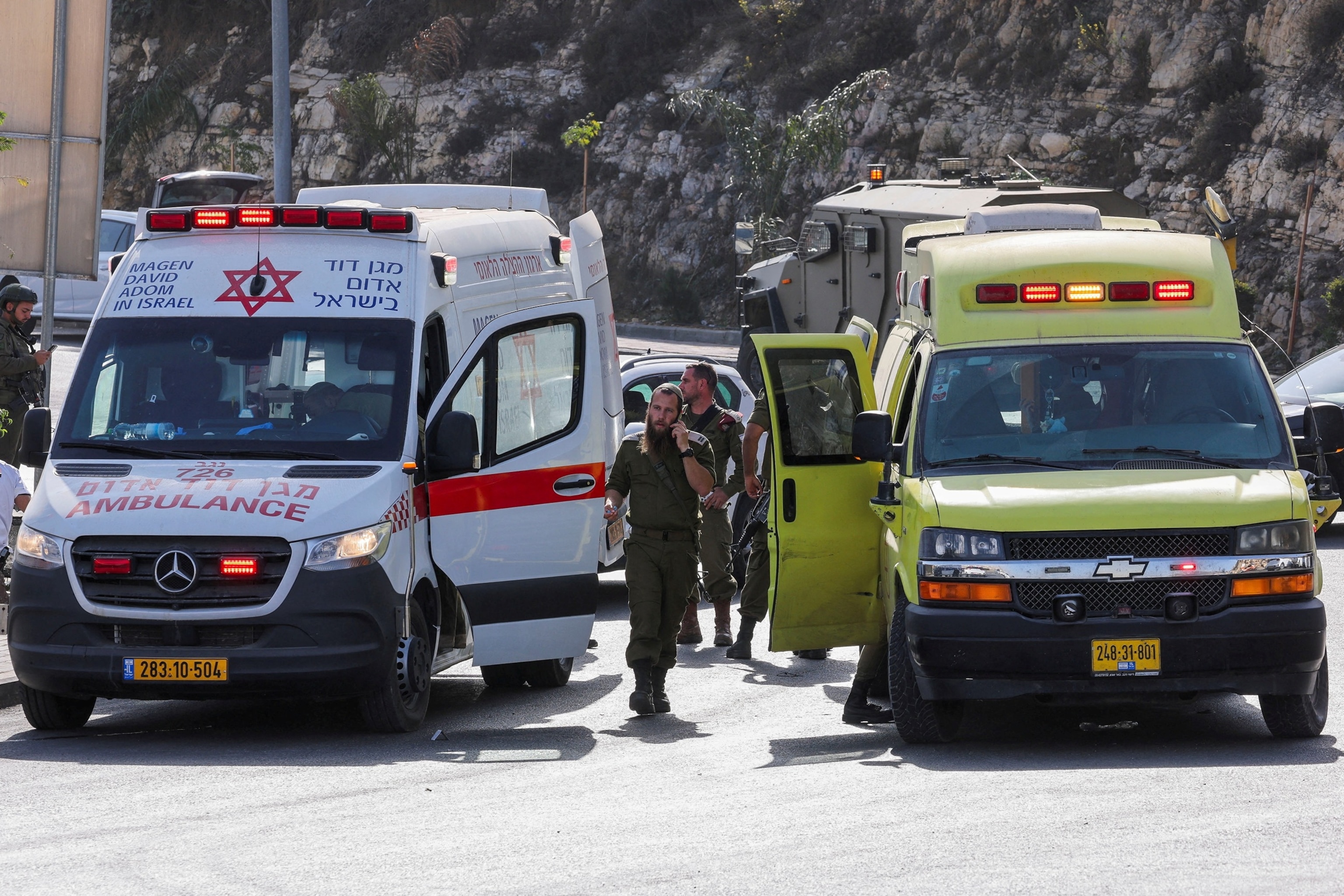 PHOTO: Israeli forces stand guard near shooting scene in Hebron in the Israeli-occupied West Bank