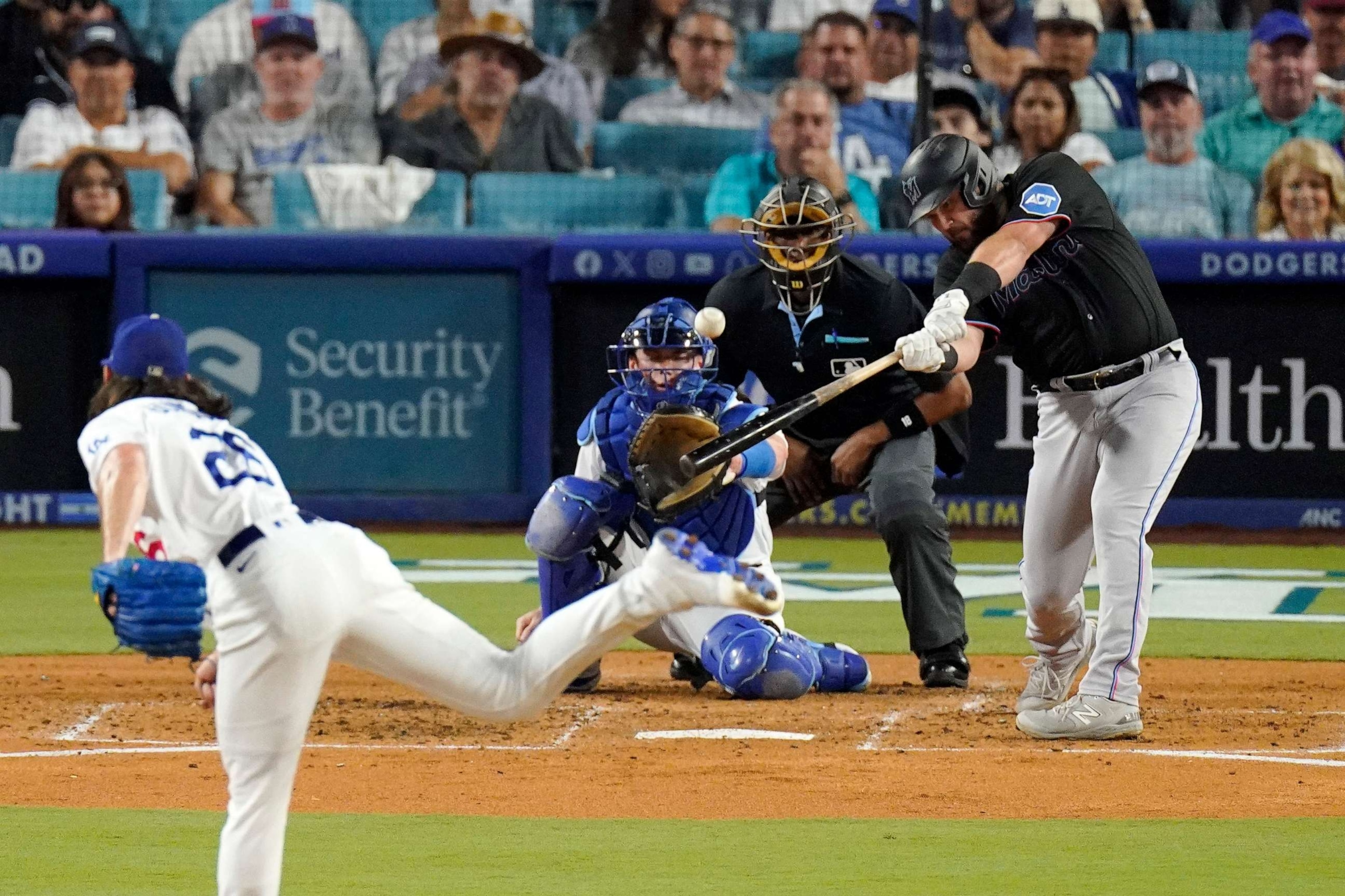 PHOTO: Miami Marlins' Jake Burger hits a three-run home run off Los Angeles Dodgers pitcher Tony Gonsolin during the third inning of a baseball game, Aug. 18, 2023, in Los Angeles.