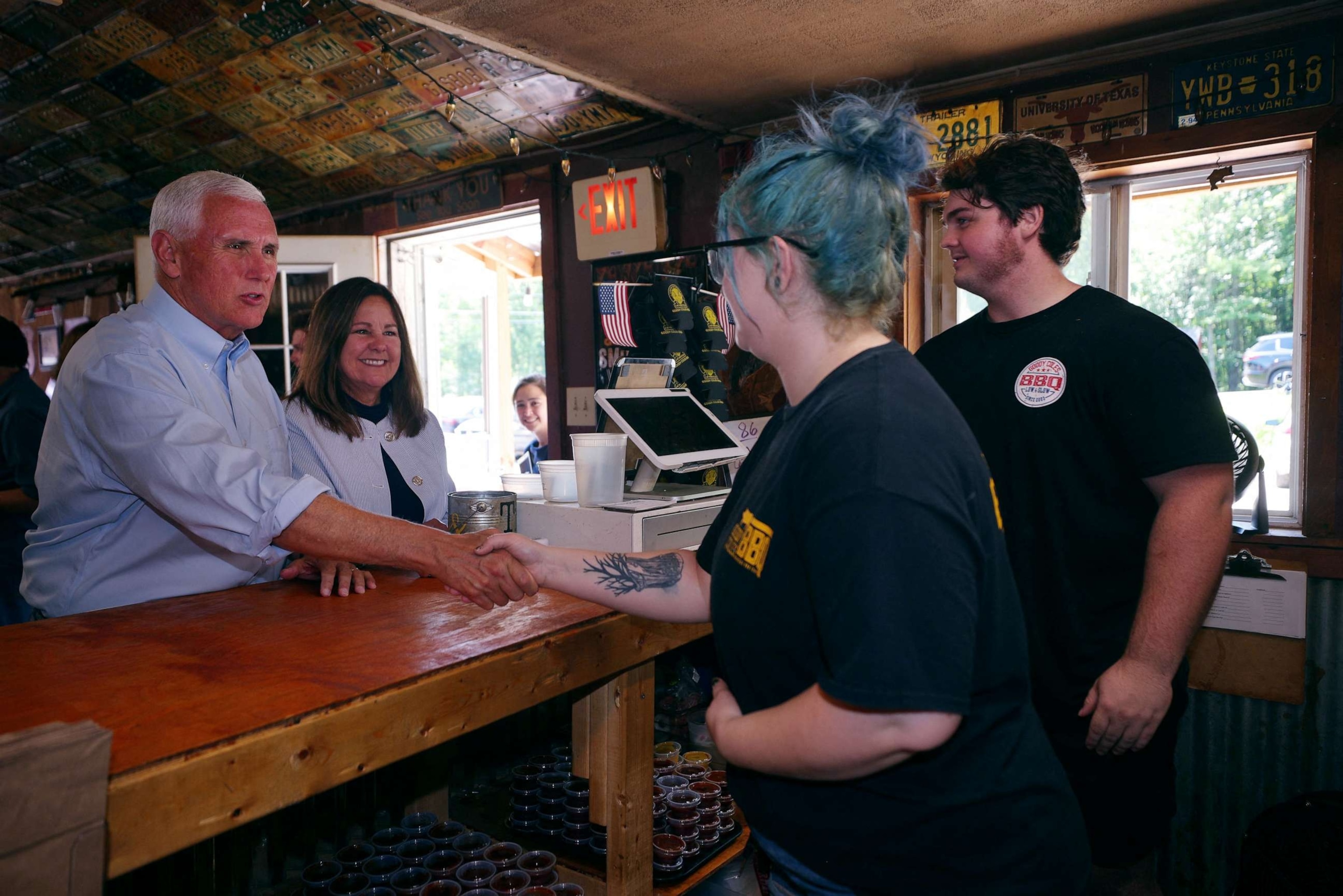 PHOTO: Republican presidential candidate former Vice President Mike Pence and his wife Karen Pence greet workers at Goody Coles BBQ Joint in Brentwood, New Hampshire, July 20, 2023.