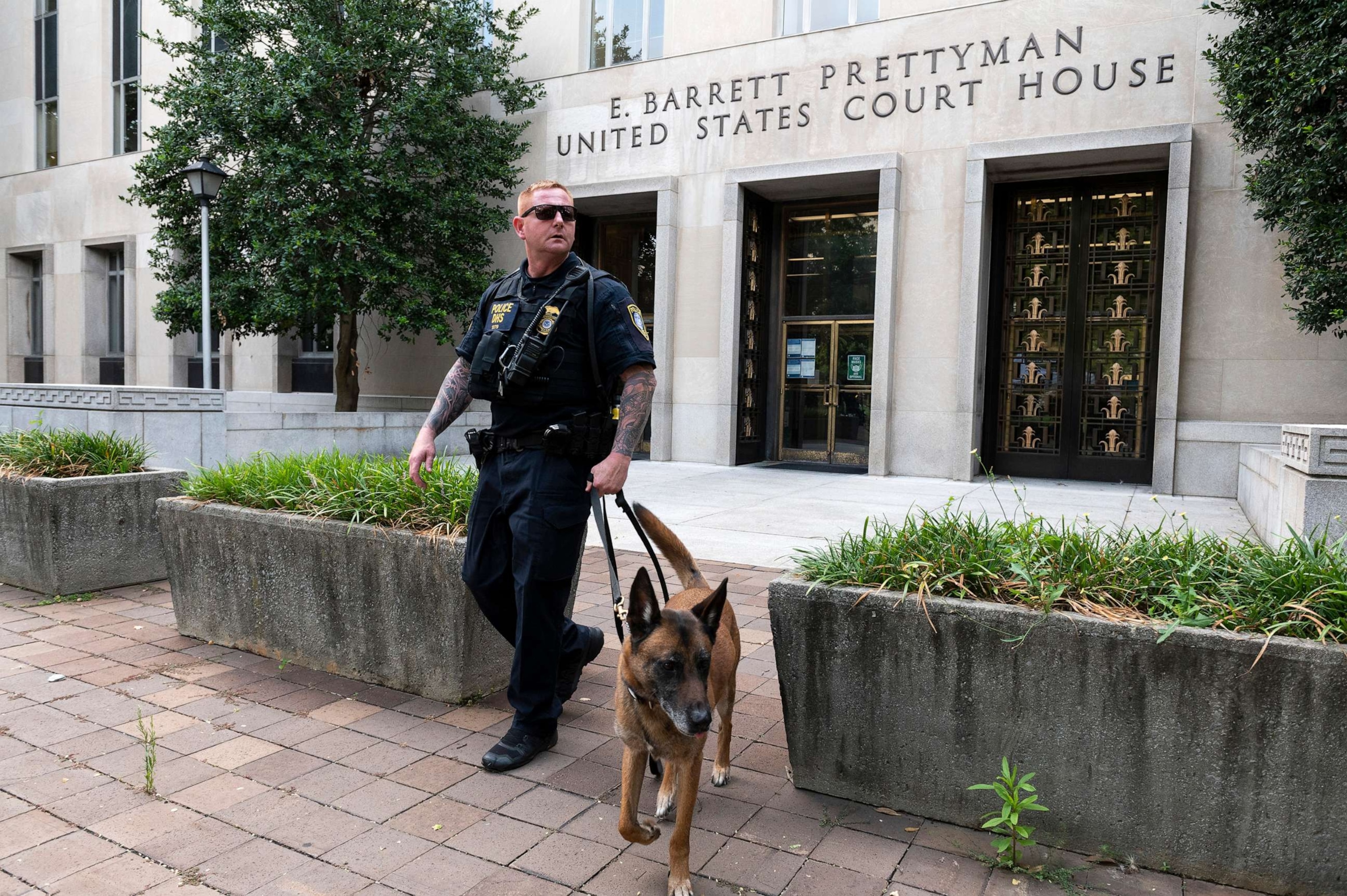 PHOTO: A Homeland Security canine unit sweeps one of the entrances to the E. Barrett Prettyman U.S. Courthouse in Washington, D.C., Aug. 3, 2023.