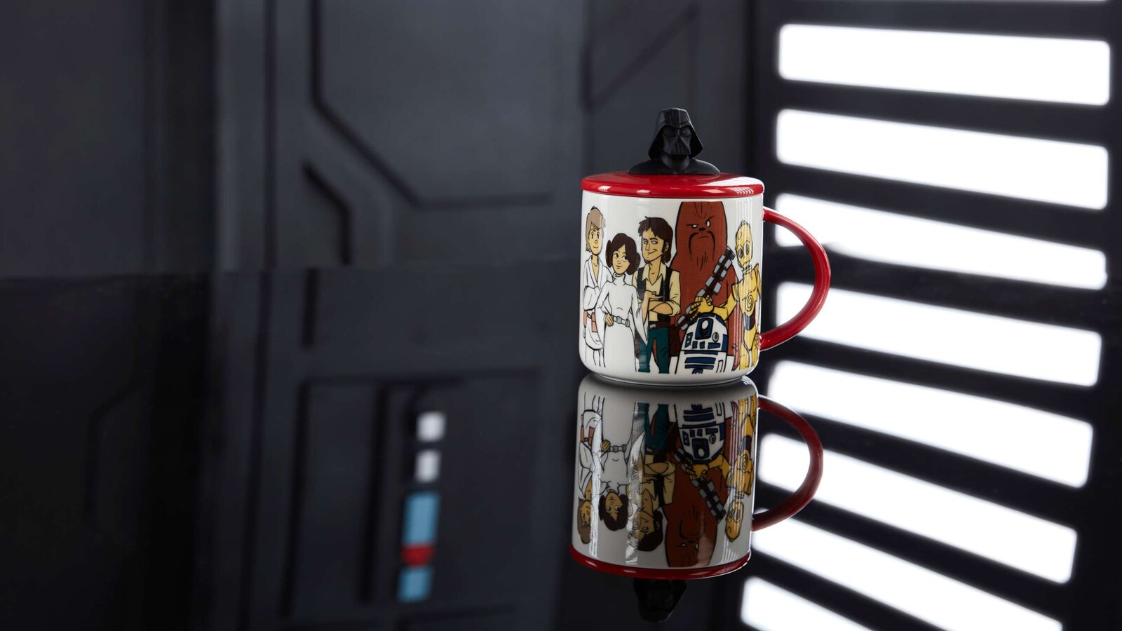 This mug features artwork of all of your favorite Star Wars characters and a Darth Vader lid.