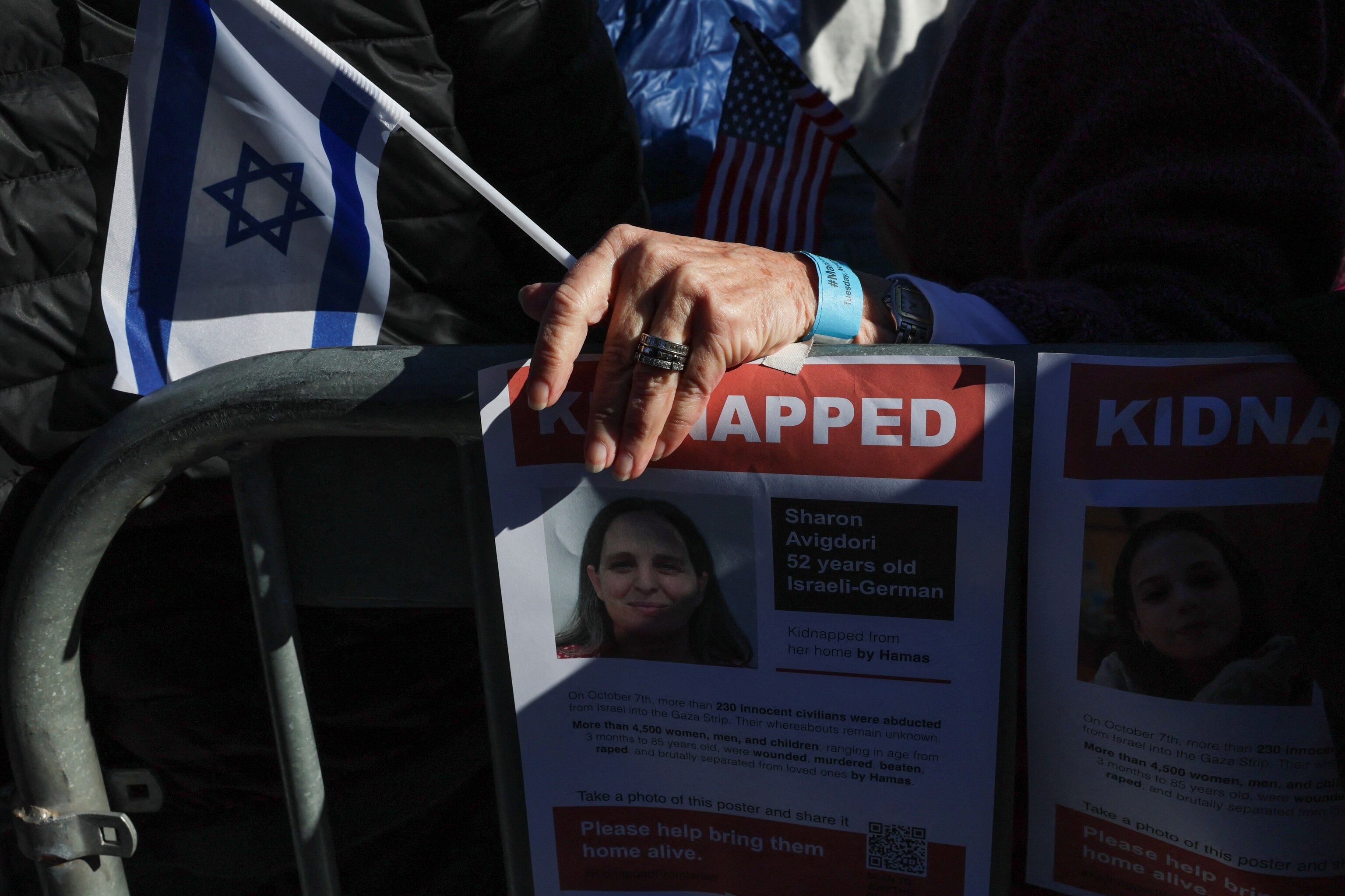 PHOTO: A person holds an Israeli flag as Israeli Americans and supporters gather in solidarity with Israel and protest against antisemitism, amid the ongoing conflict with Hamas, during a rally on the National Mall in Washington, Nov. 14, 2023. 