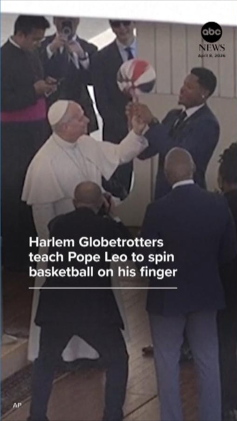 WATCH:  Harlem Globetrotters teach Pope Leo to spin basketball on his finger