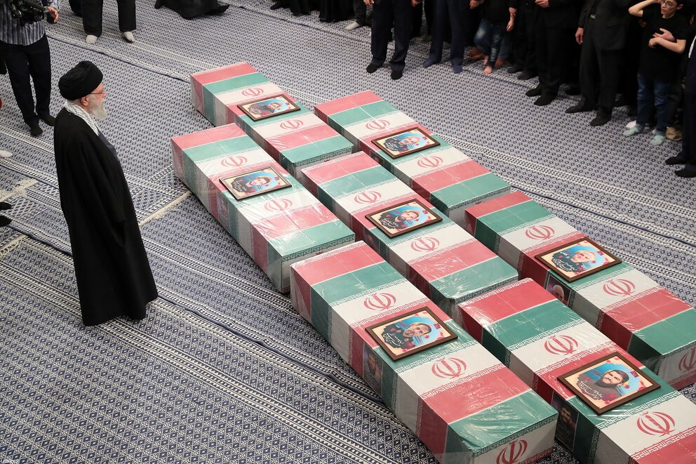 PHOTO: A handout picture provided by the office of Iran's Supreme Leader Ayatollah Ali Khamenei, April 4, 2024, shows the supreme leader praying over the coffins of seven Revolutionary Guard Corps members killed.
