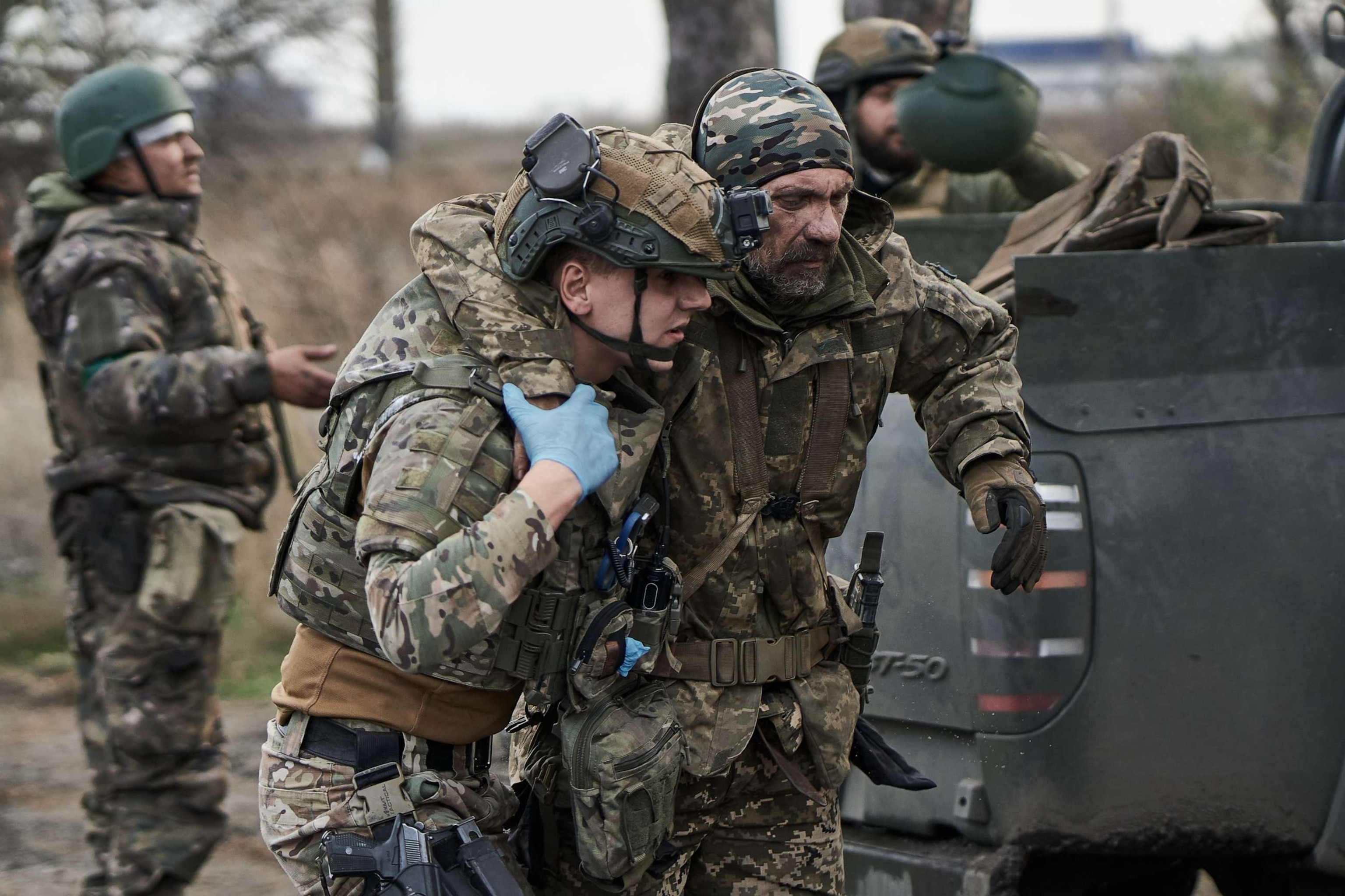 PHOTO: A Ukrainian military man is helped at the evacuation point on Nov. 1, 2023 in Kupiansk, Ukraine.