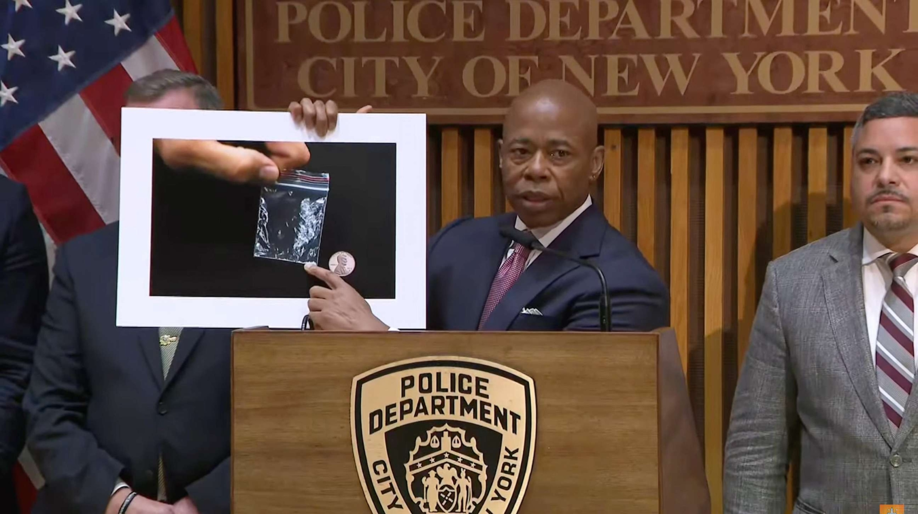 PHOTO: Mayor Eric Adams held up a graphic of a bag of fentanyl next to a penny during a press conference on Public Safety with NYPD Commissioner Caban at 1 Police Plaza in New York City, Sept. 18, 2023.