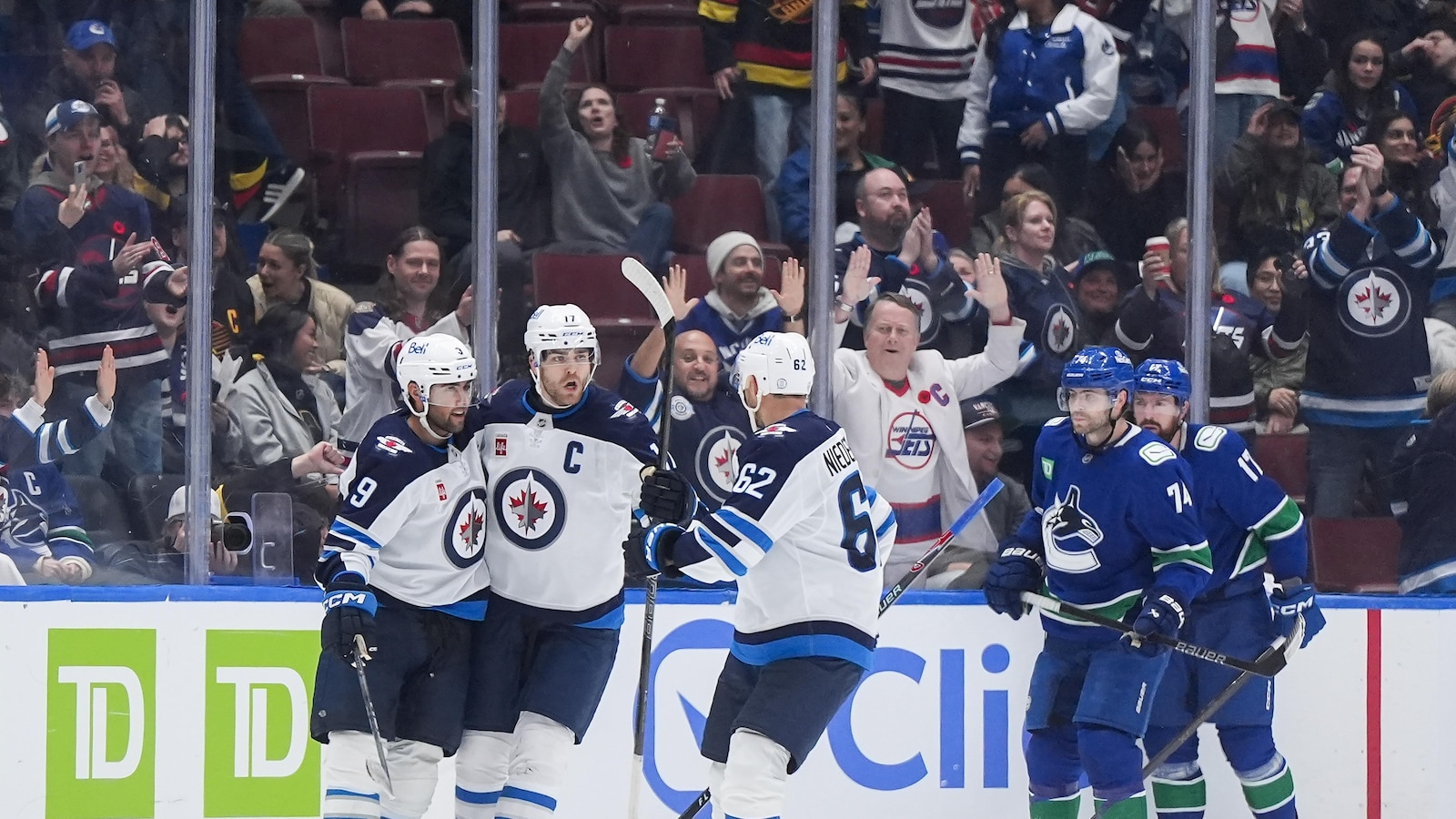 Morrissey and Hellebuyck lead Jets past Canucks 5-3 to halt 3-game slide