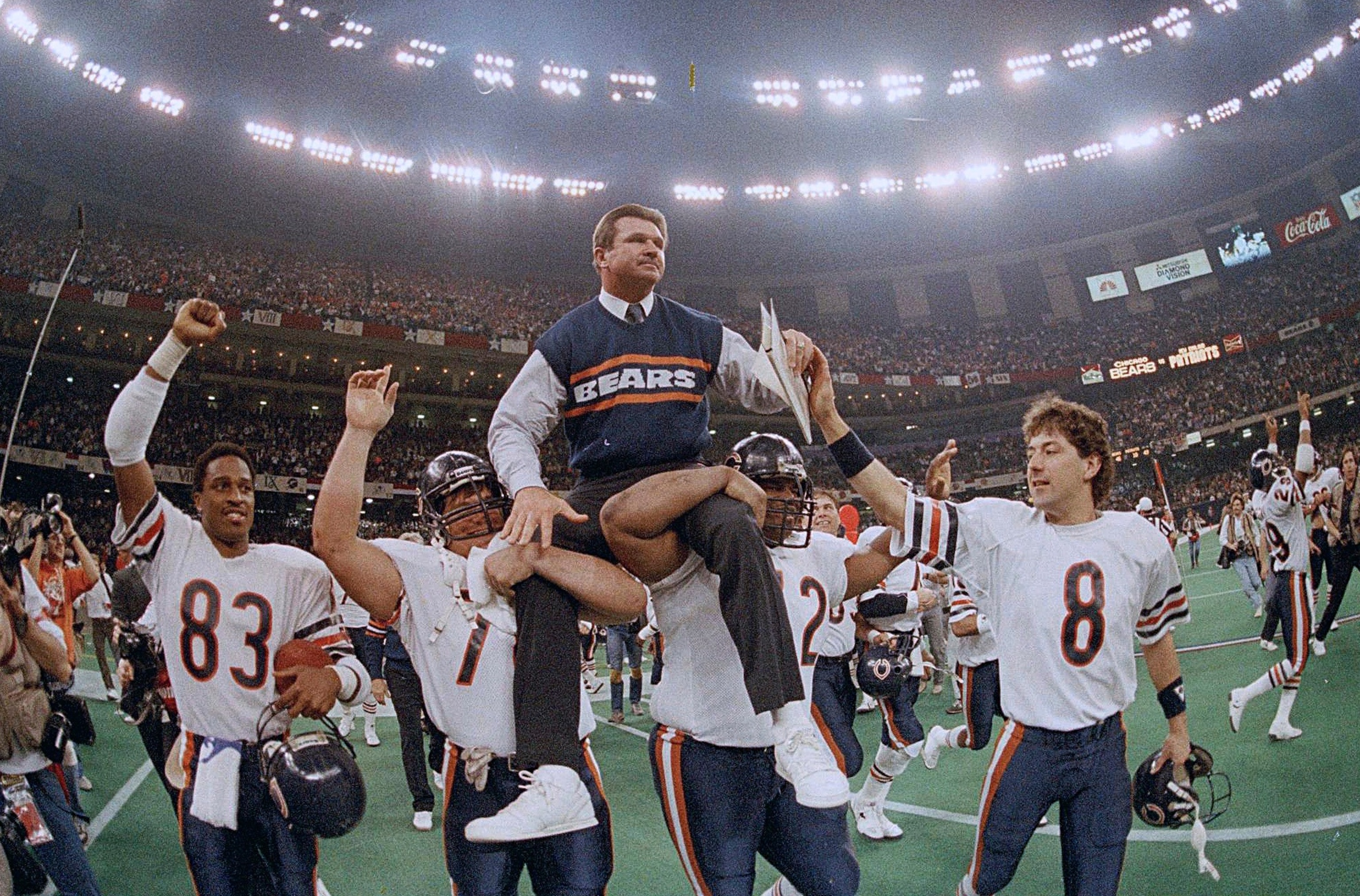 PHOTO: Chicago Bears coach Mike Ditka is carried off the field by Steve McMichael, left, and William Perry after the Bears defeated the New England Patriots in Super Bowl 20 in New Orleans on Jan. 26, 1986.