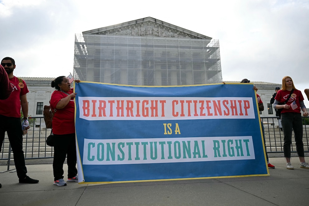 PHOTO: People participate in a protest outside the Supreme Court over President Donald Trump's move to end birthright citizenship as the court hears arguments over the order in Washington,  May 15, 2025.
