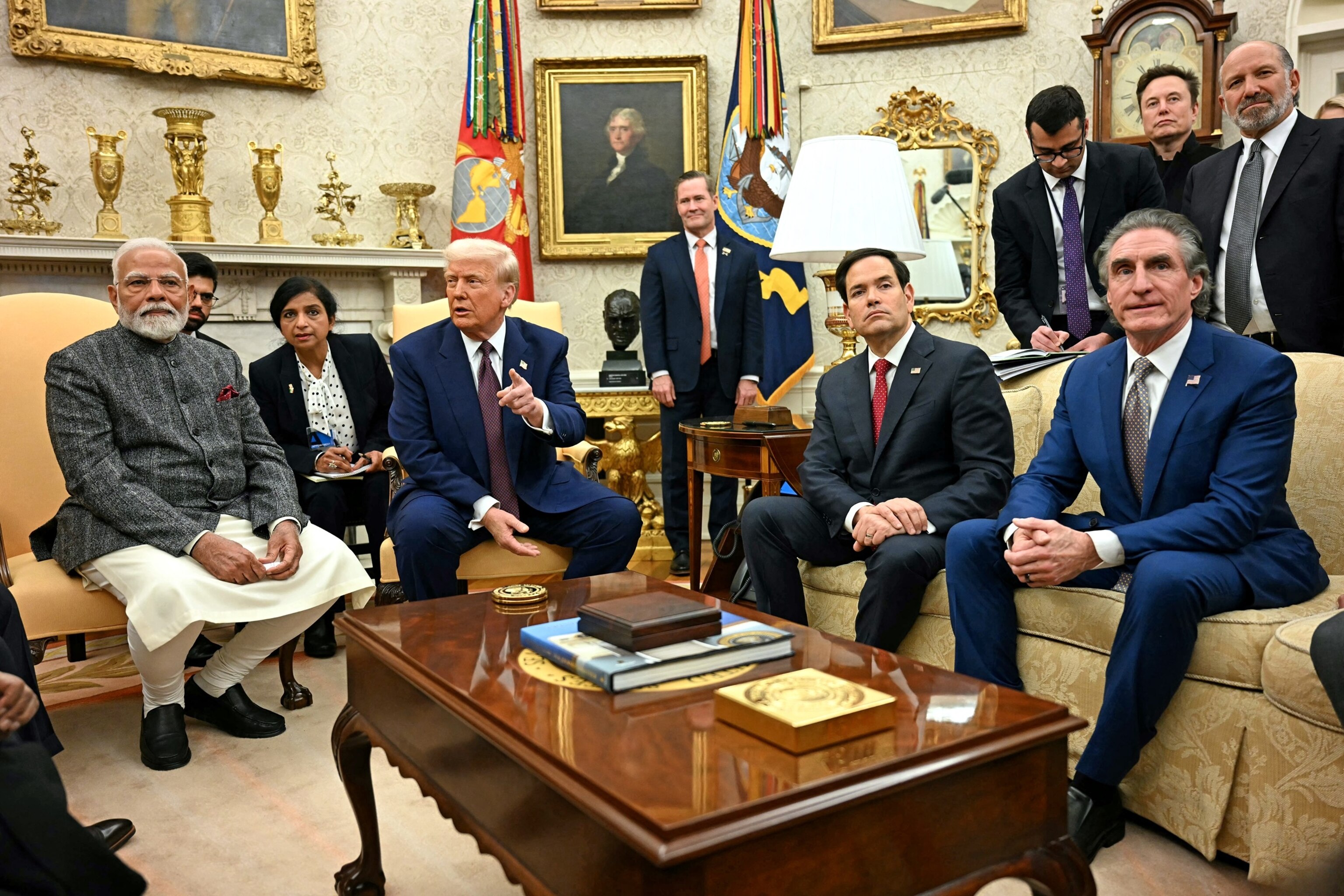 PHOTO: President Donald Trump speaks with the press as he meets with Indian Prime Minister Modi, alongside Secretary of State Marco Rubio (2nd R) and Secretary of the Interior Doug Burgum (R), in the Oval Office in Washington, D.C., on Feb. 13, 2025.