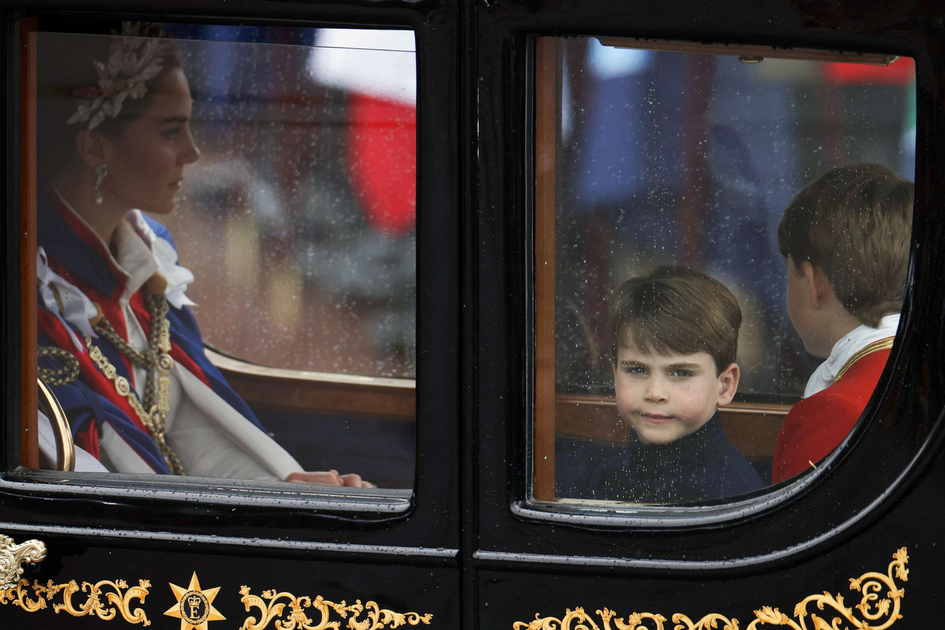 PHOTO: Catherine, Princess of Wales, Prince Louis of Wales and Page of Honour Prince George depart the Coronation service of King Charles III and Queen Camilla, May 06, 2023 in London.