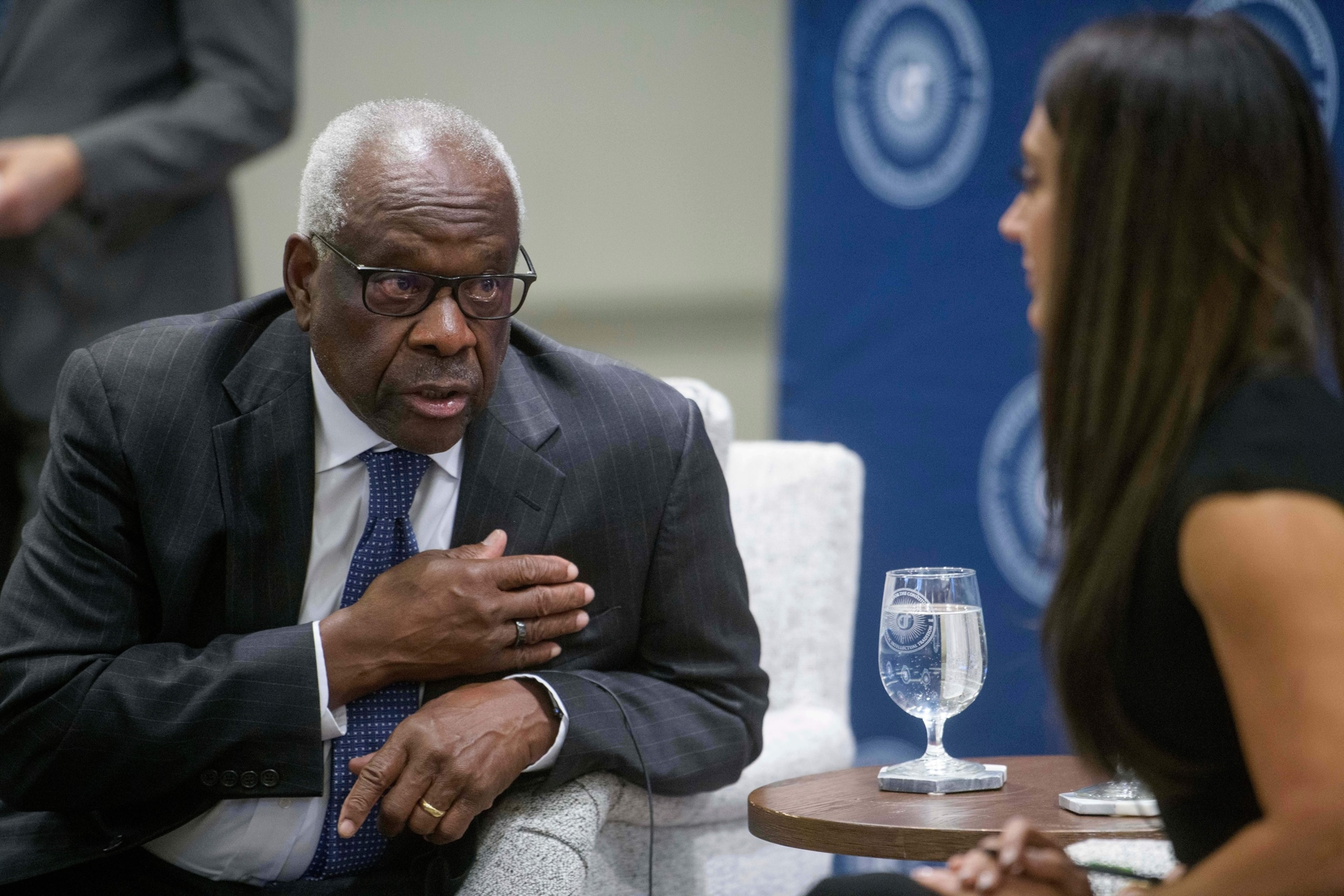 PHOTO: Supreme Court Associate Justice Clarence Thomas, left, talks with Professor Jennifer Mascott, right at The Catholic University of America's Columbus School of Law, Sept. 25, 2025, in Washington, D.C.