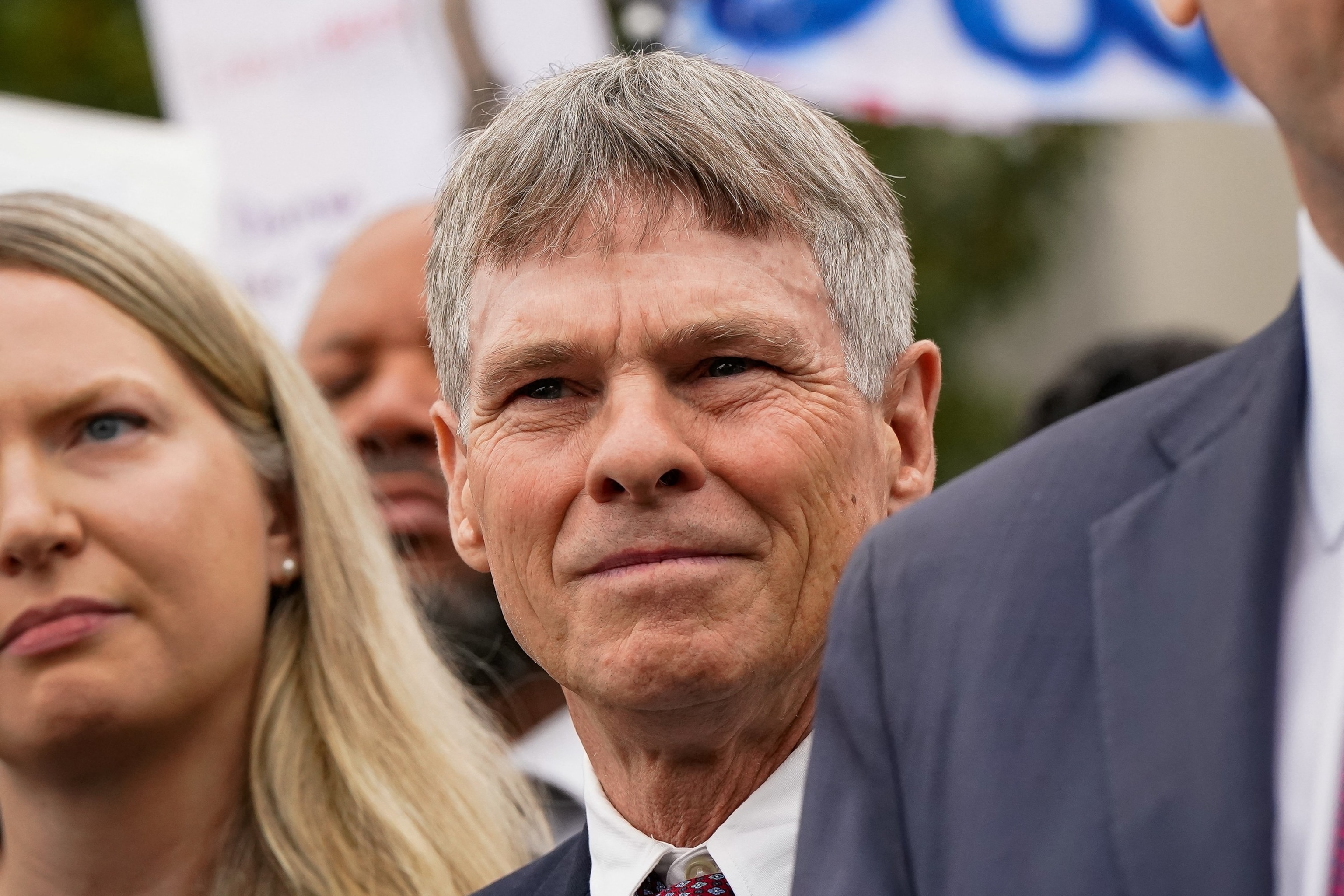 PHOTO: Former U.S. Olympic canoeist David Hearn stands with his lawyer as they speak to reporters following Hearn's arraignment on a felony destruction of property charge at DC Superior Court in Washington, July 9, 2026.