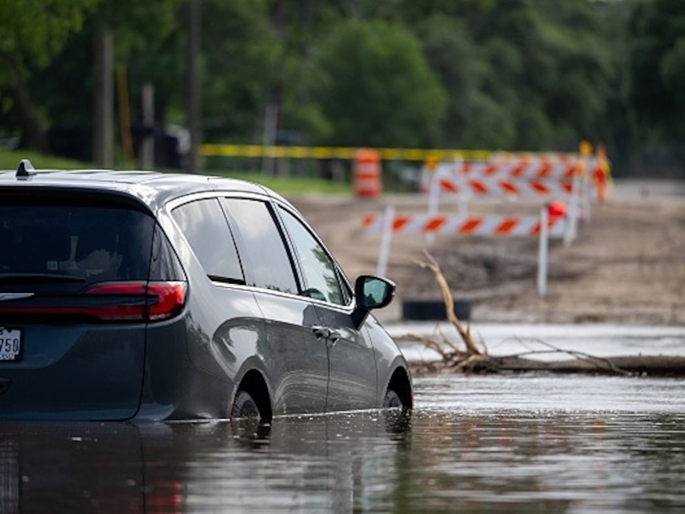 PHOTO: A vehicle sits in floodwater, July 17, 2026, in Uvalde, Texas, following flash floods that swept across parts of Central Texas, prompting evacuations and hundreds of water rescues.