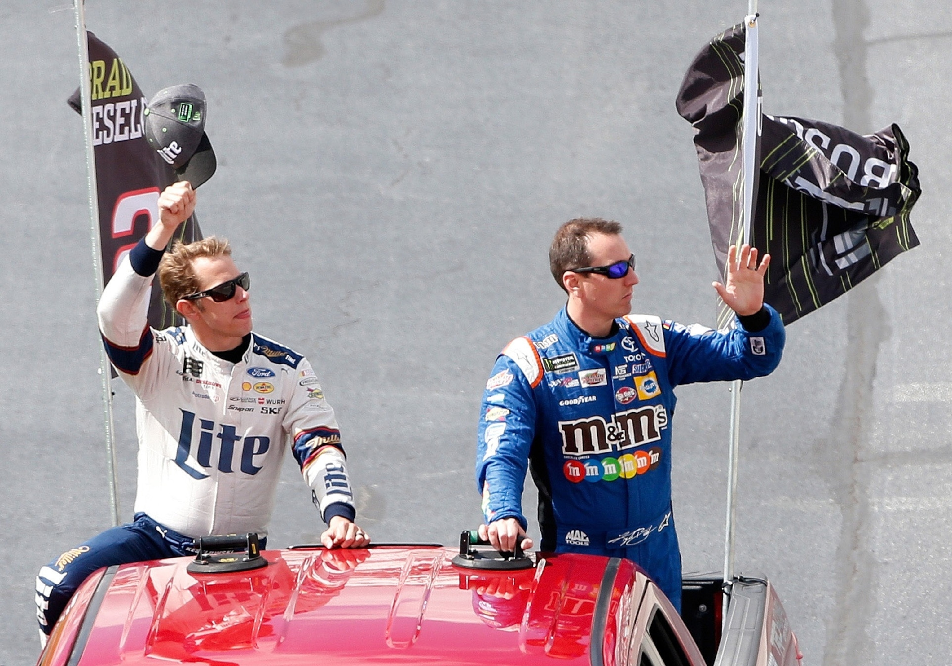 PHOTO: Brad Keselowski and Kyle Busch take a ride around the track to acknowledge the fans prior to the Monster Energy NASCAR Cup Series Apache Warrior 400 presented by Lucas Oil at Dover International Speedway on Oct. 1, 2017, in Dover, Delaware.