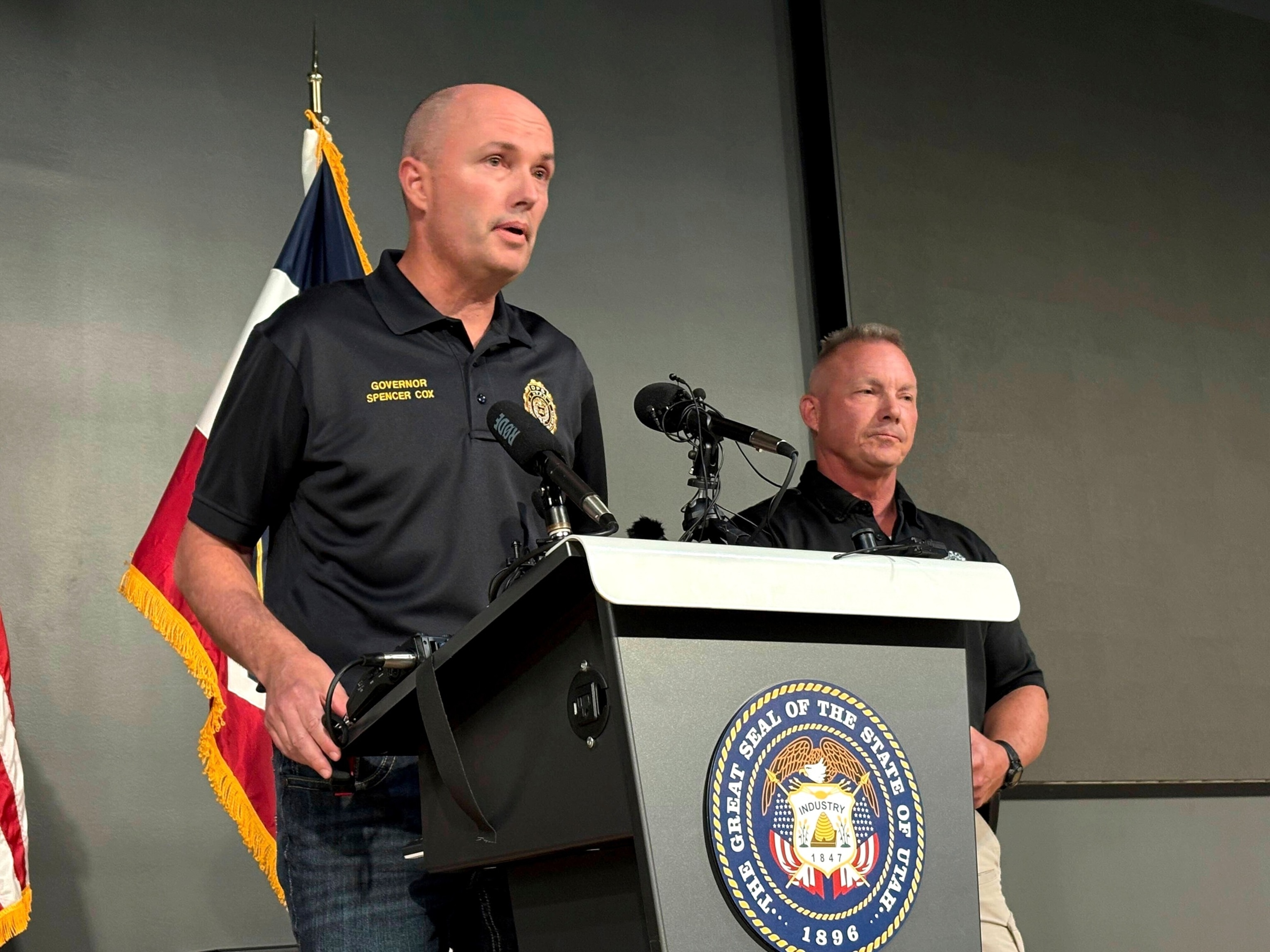 PHOTO: Utah Gov. Spencer Cox, left, speaks at the Keller Building on the Utah Valley University campus after Charlie Kirk was shot and died during Turning Point's visit to the university, Sept. 10, 2025, in Orem, Utah. 
