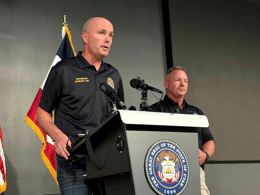 PHOTO: Utah Gov. Spencer Cox, left, speaks at the Keller Building on the Utah Valley University campus after Charlie Kirk was shot and died during Turning Point's visit to the university, Sept. 10, 2025, in Orem, Utah. 