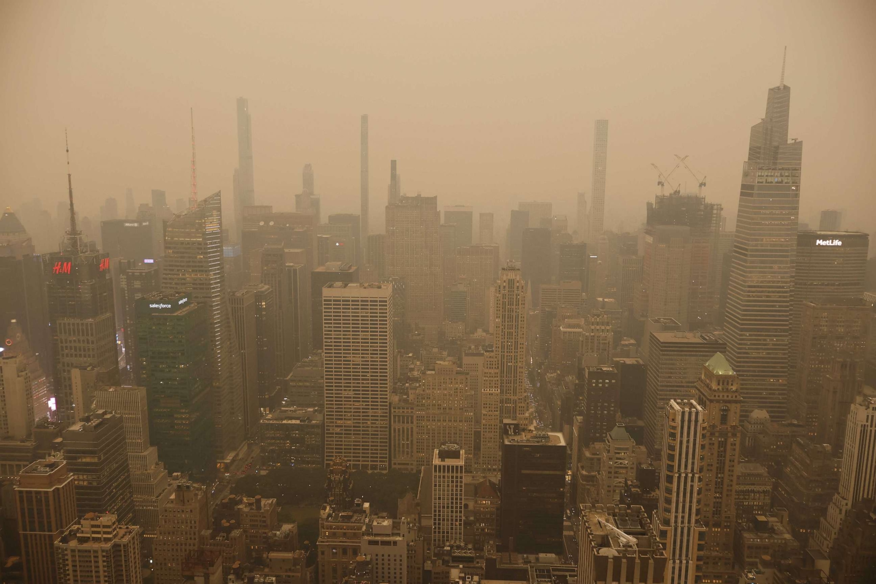 PHOTO: Manhattan's skyline is barely visible before sunset as the city is enveloped in smoke from continued wildfires in Canada on June 6, 2023, New York City.