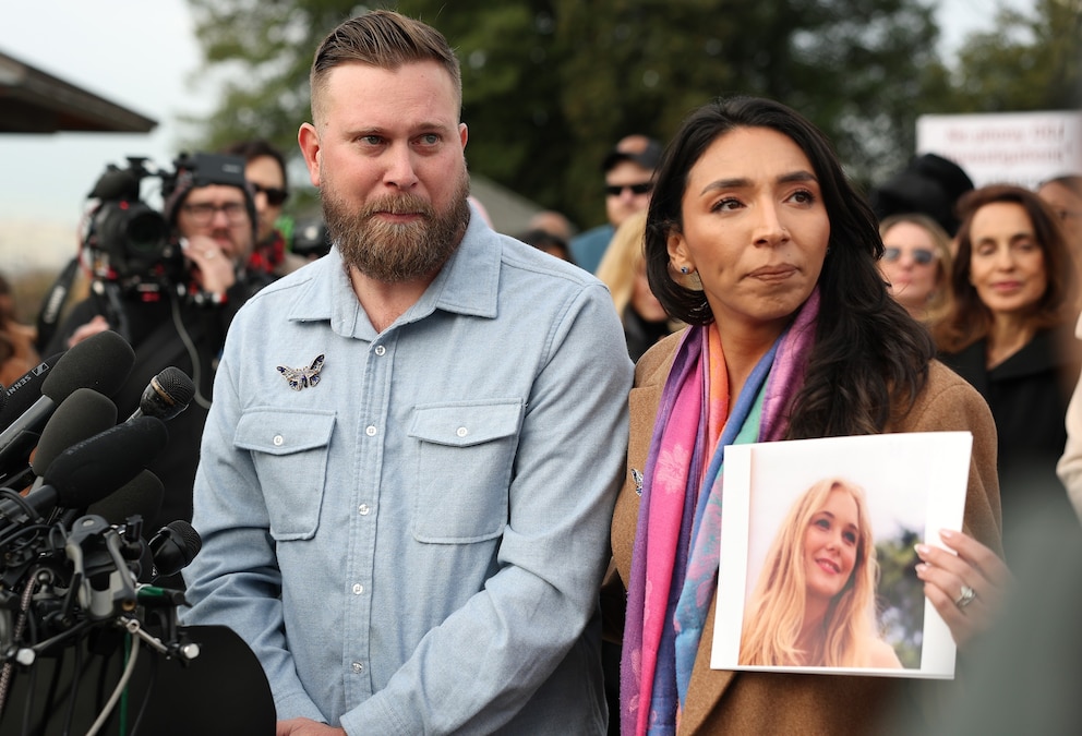PHOTO: Sky Roberts, brother of Virginia Giuffre, who was abused by Jeffrey Epstein, and his wife Amanda Roberts hold up a photo of Giuffre during a news conference on the Epstein Files Transparency Act outside the Capitol, Nov. 18, 2025 in Washington.