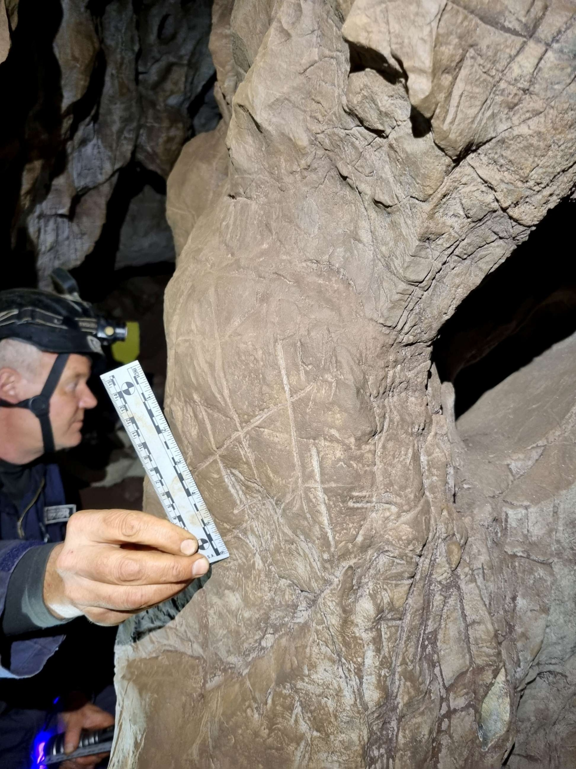 PHOTO: Carvings found near Homo naledi graves in the Rising Star cave system are the first evidence of ritual burials outside of the human species.