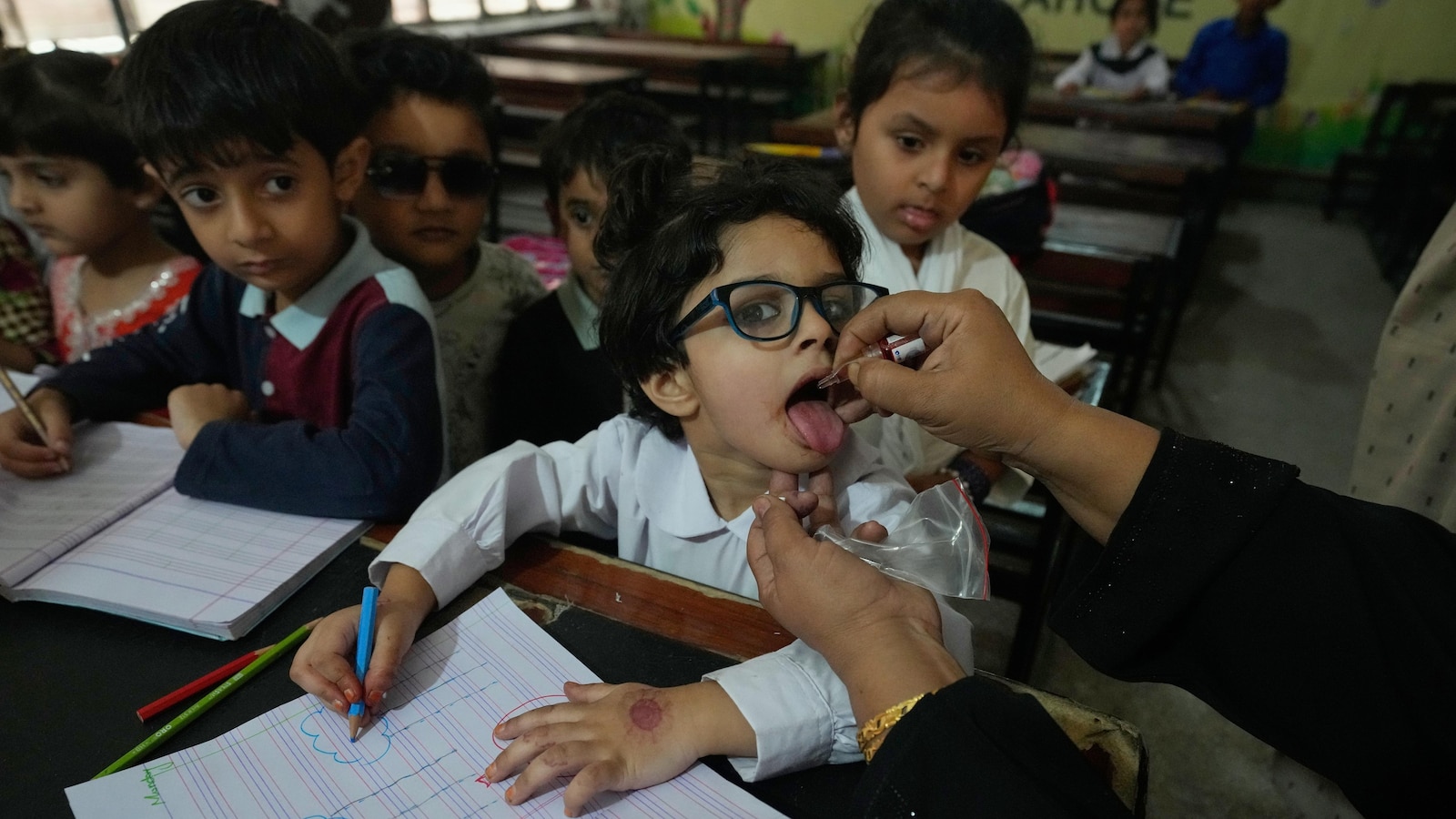 Suspected militants kill police officer assigned to guard polio team