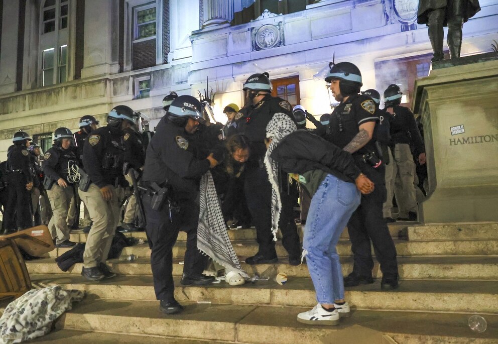 PHOTO: In this April 30, 2024, file photo, New York Police Department officers detain dozens of pro-Palestinian students at Columbia University, in New York.