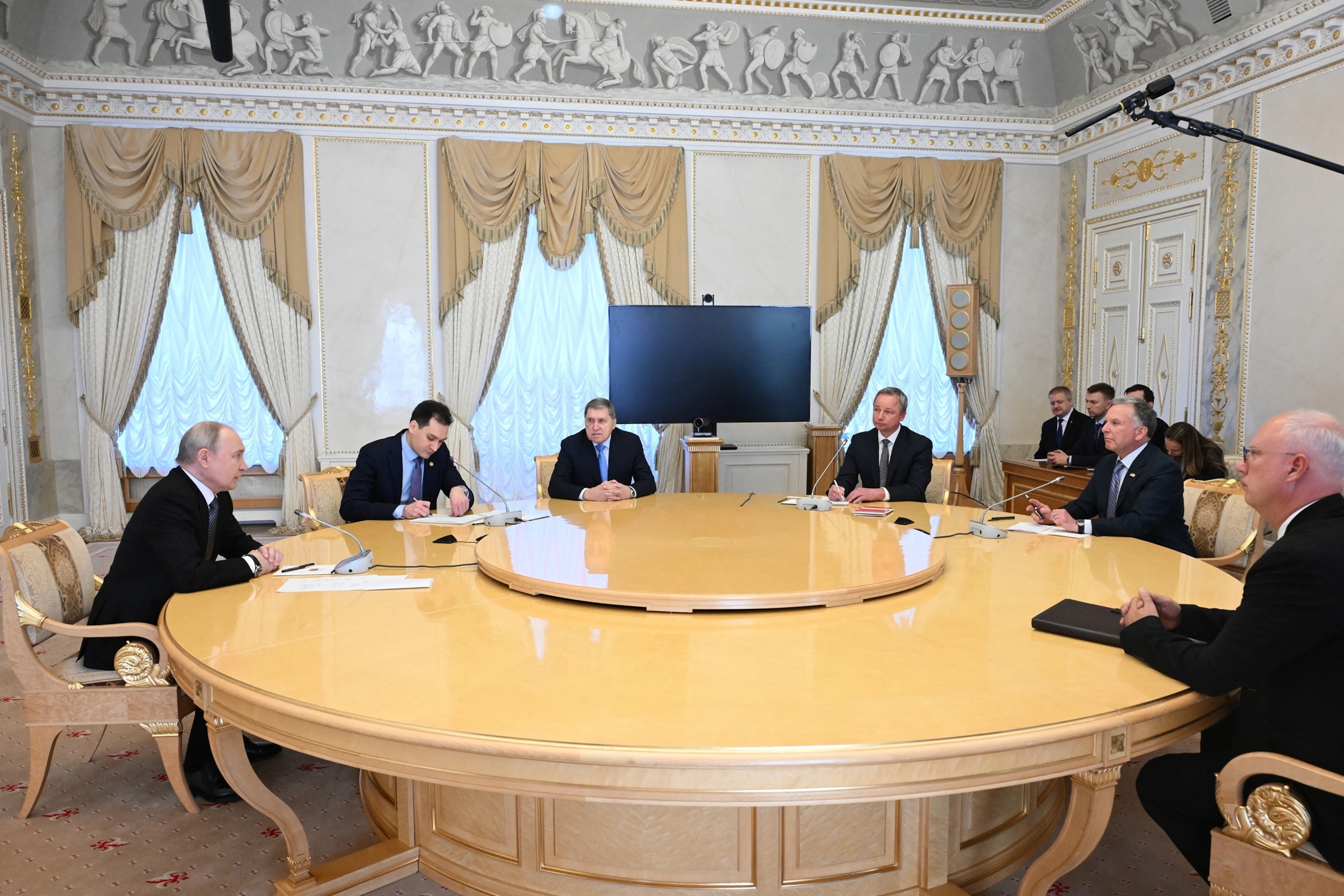 PHOTO: Russia's President Vladimir Putin, Kremlin foreign policy aide Yuri Ushakov and presidential envoy Kirill Dmitriev attend a meeting with U.S. special envoy Steve Witkoff in St. Petersburg on Oct. 21, 2026.
