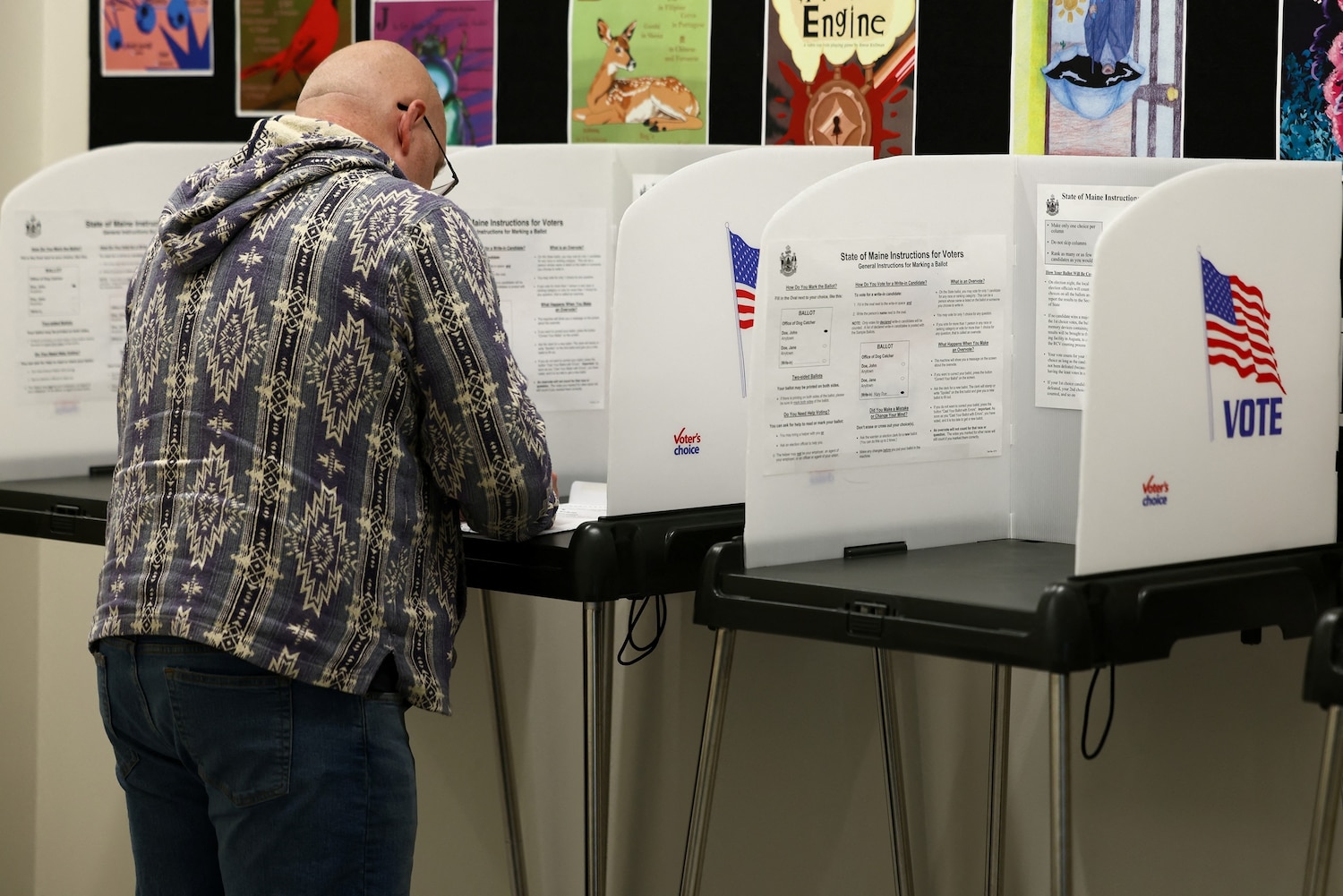 A man fills his ballot during early midterm voting in the town hall in Bangor, Maine, October 16, 2026. Charly Triballeau/AFP via Getty Images