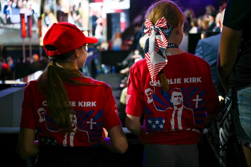PHOTO: Attendees wear shirts showing images of slain activist Charlie Kirk,during the second day of the Republican National Committee midterm convention at the American Airlines Center in Dallas,Sept. 10, 2026.