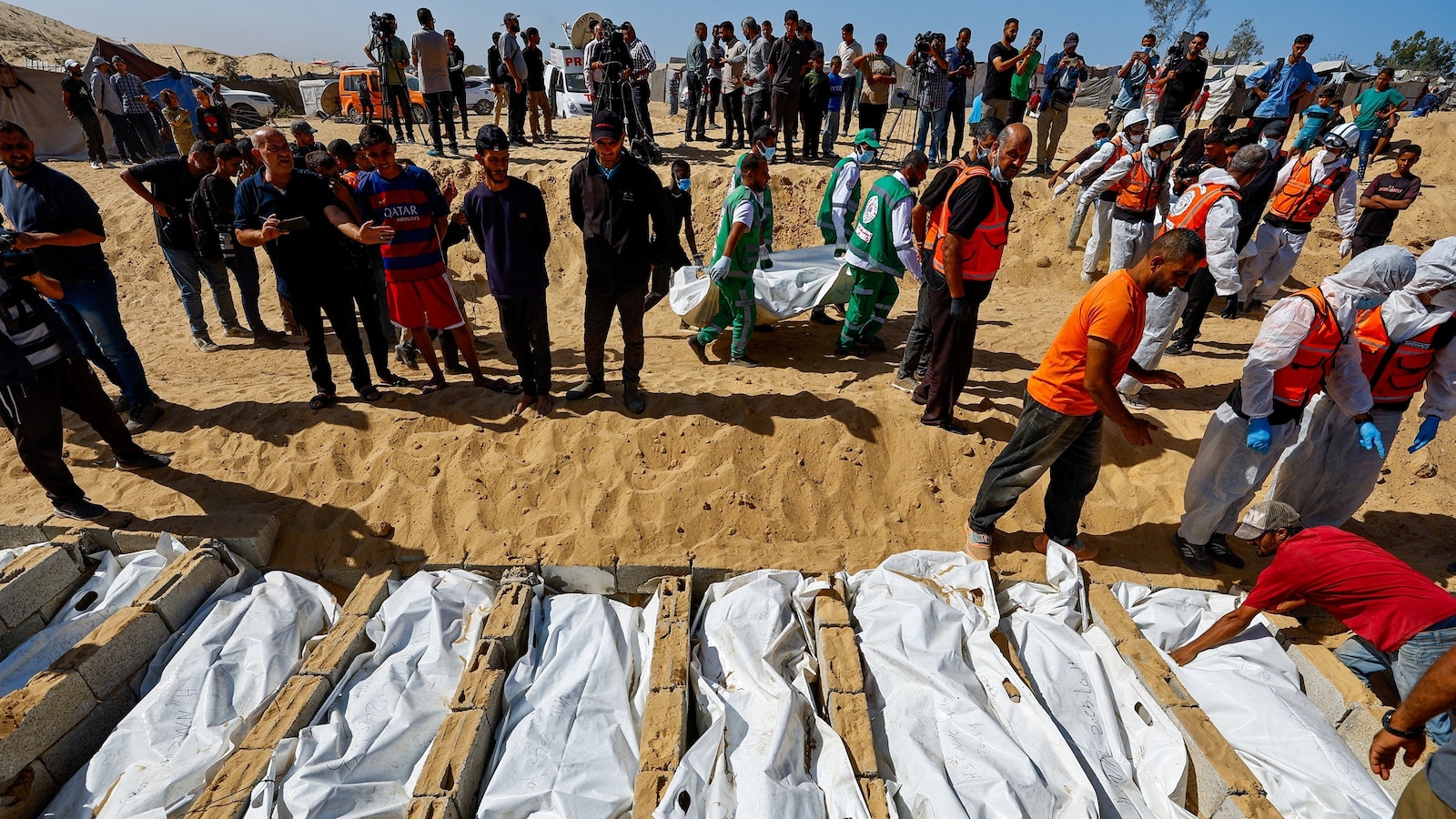 Mass funeral held in Gaza for Palestinian prisoner remains returned by Israel as Palestinian officials allege signs of torture