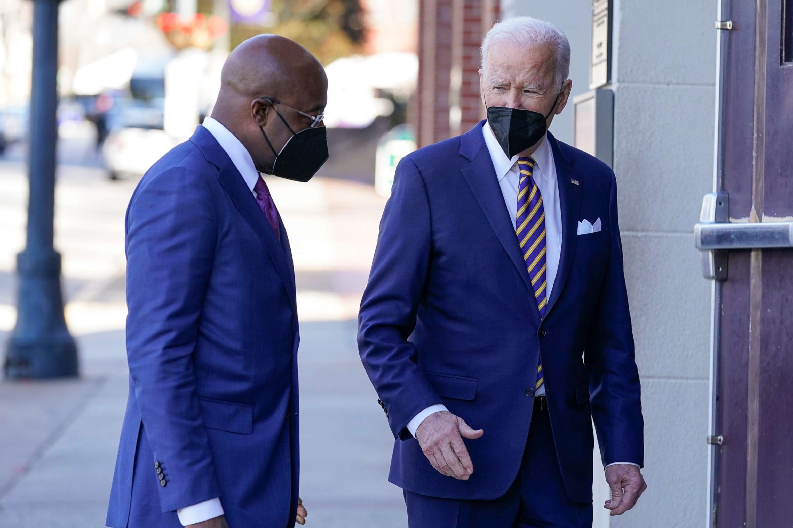 PHOTO: In this Jan. 11, 2022, file photo, President Joe Biden and Sen. Raphael Warnock enter Ebenezer Baptist Church in Atlanta.