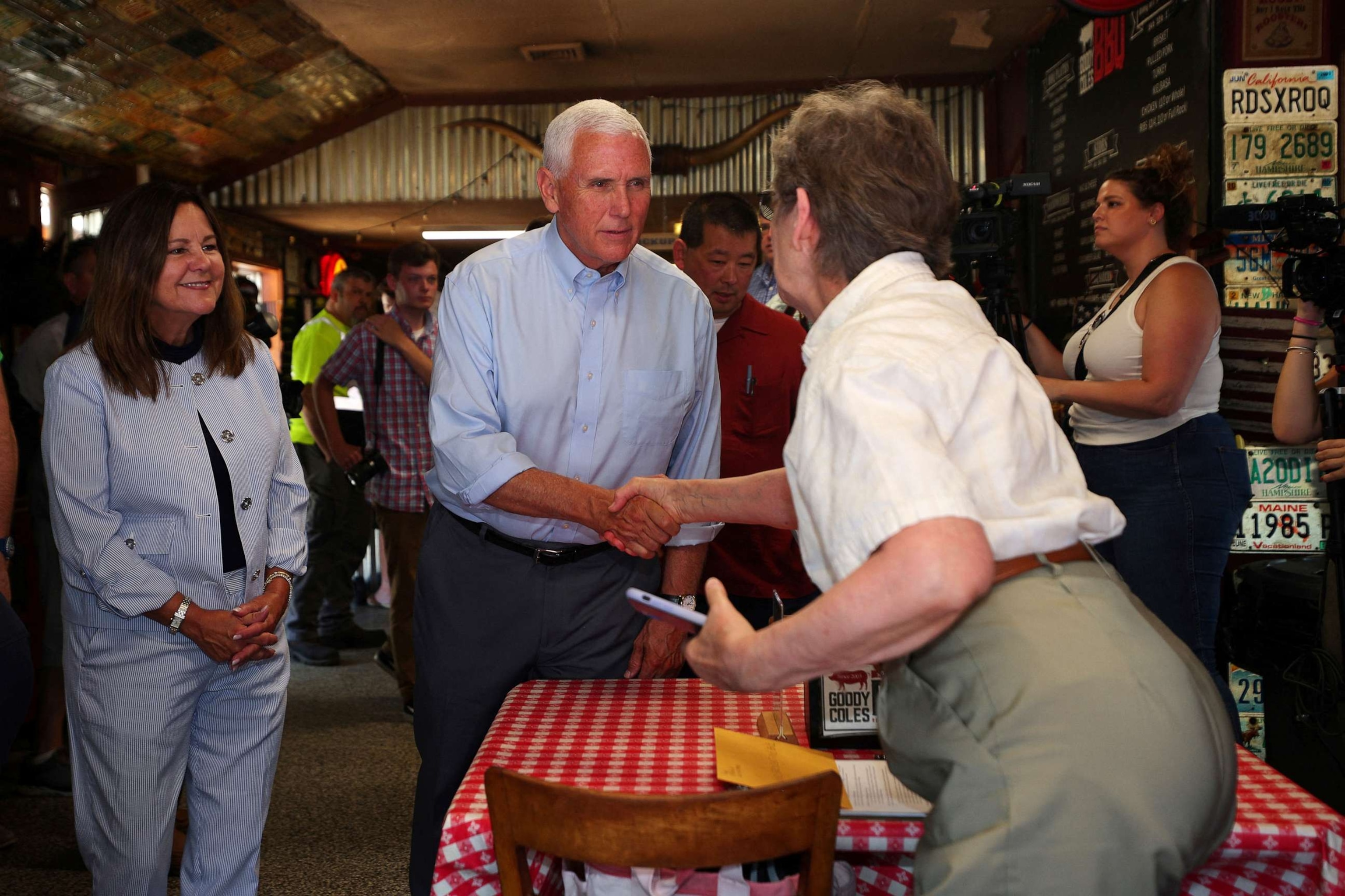 PHOTO: Republican presidential candidate former Vice President Mike Pence and his wife Karen Pence visit Goody Coles BBQ Joint in Brentwood, New Hampshire, July 20, 2023.