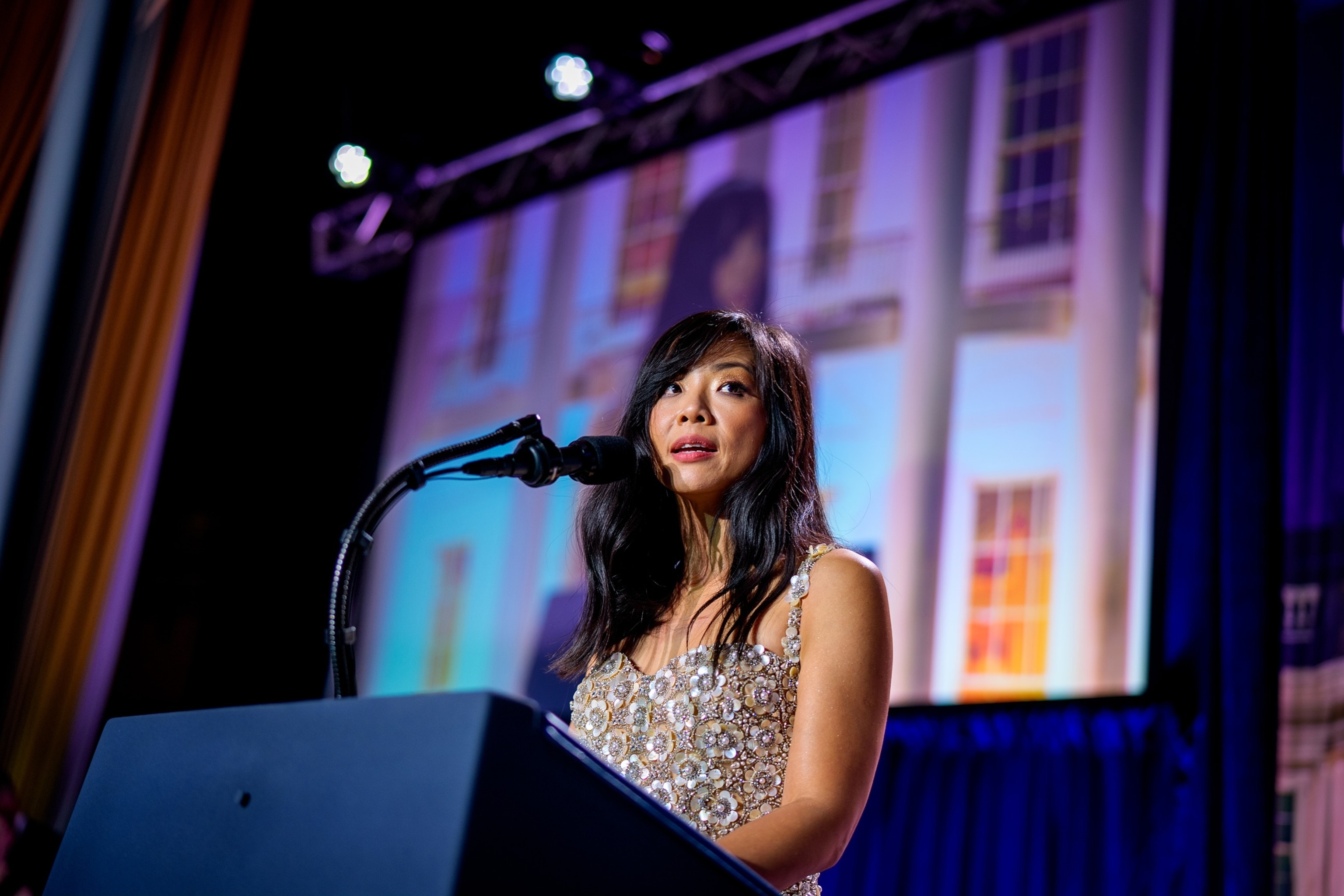 White House Correspondents Association President Weijia Jiang comes back to the stage to speak after a shooting incident at the annual White House Correspondents Association Dinner April 25, 2026, in Washington, D.C. 
