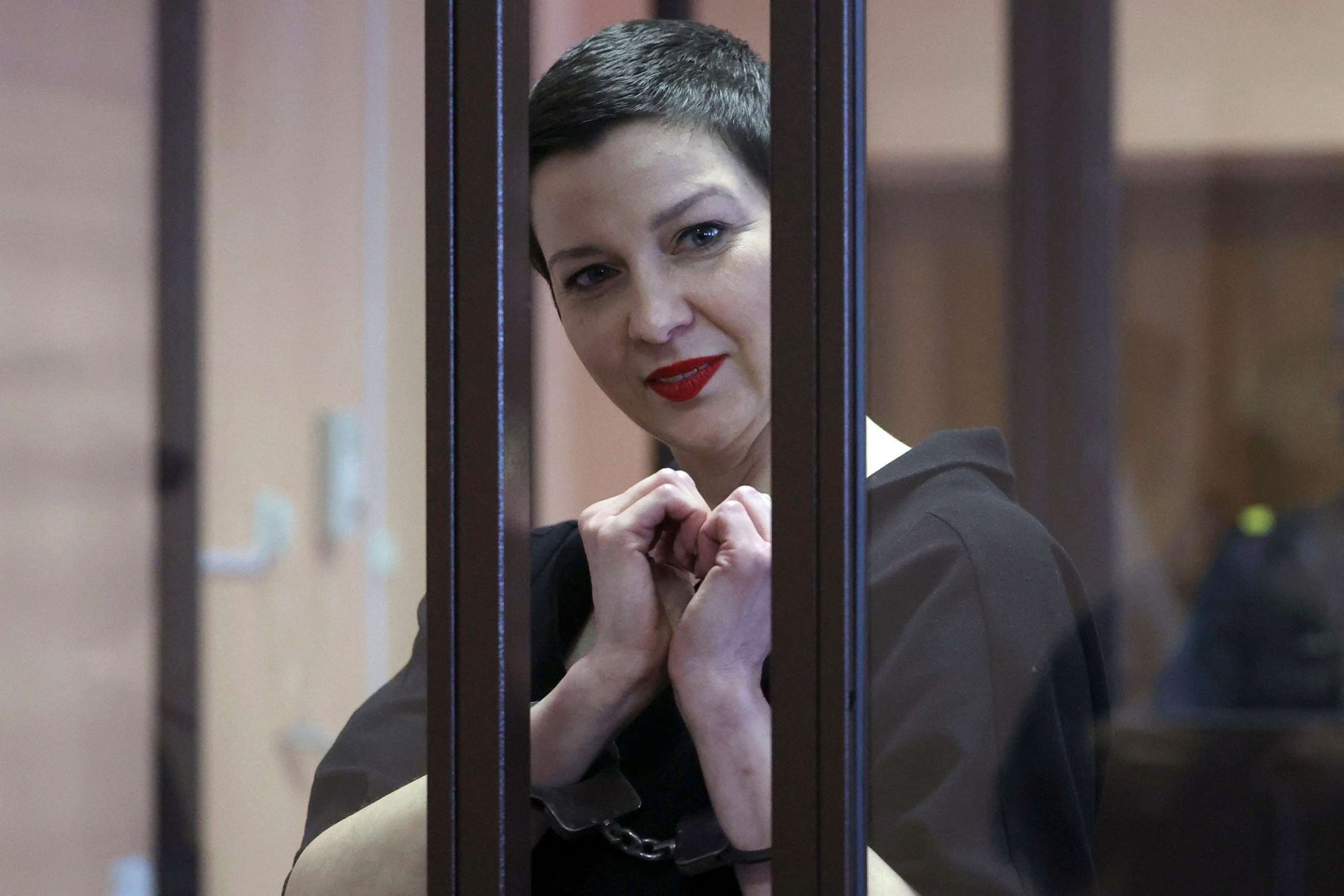 PHOTO: Maria Kolesnikova gestures inside the defendants' cage during her verdict hearing on charges of undermining national security, conspiring to seize power and creating an extremist group, on Sept. 6, 2021, in Minsk, Belarus.