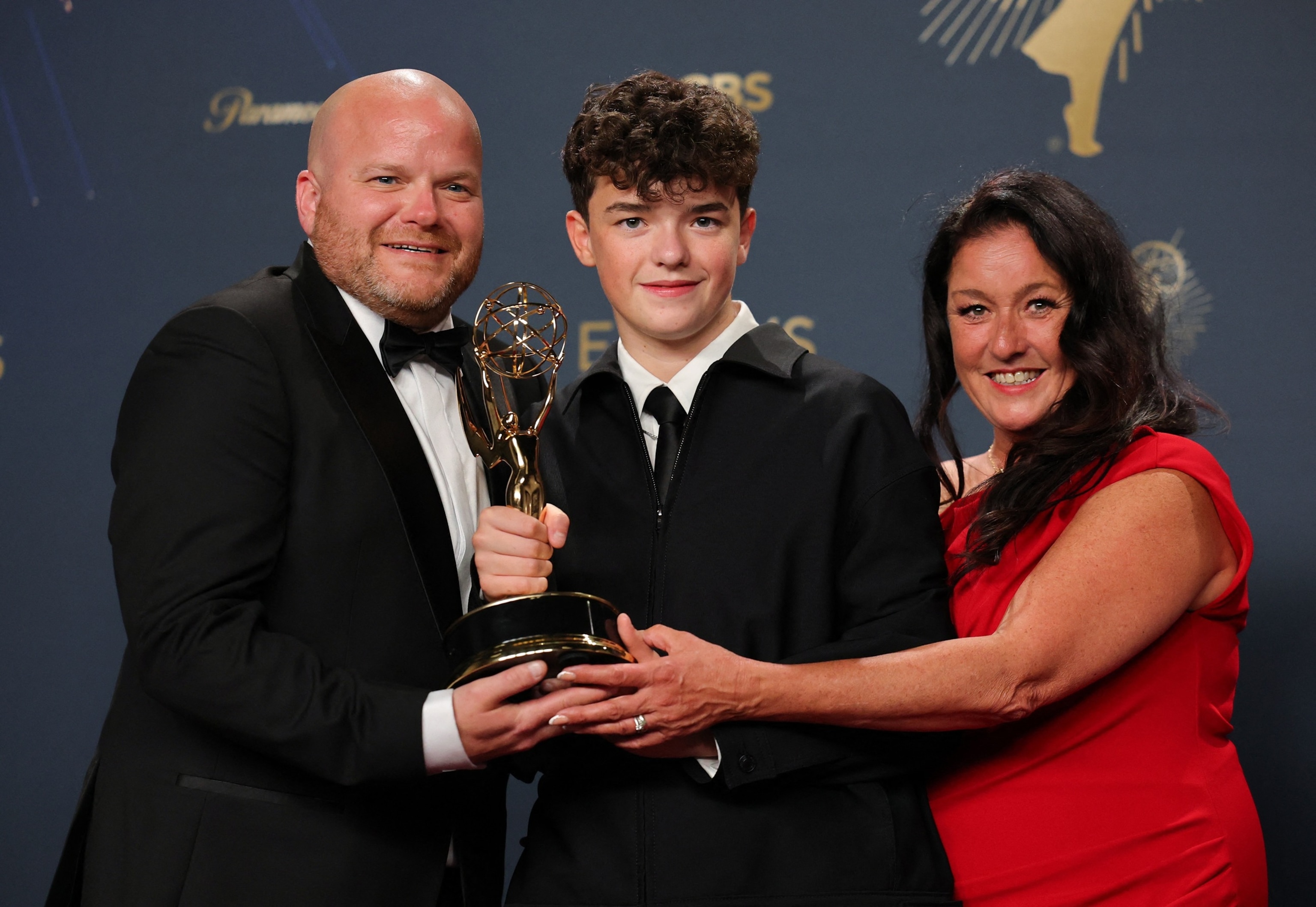 PHOTO: Owen Cooper poses with his father Andy and mother Noreen after winning Best Supporting Actor in a Limited or Anthology Series or Movie award for Adolescence at the 77th Primetime Emmy Awards in Los Angeles, September 14, 2025. 