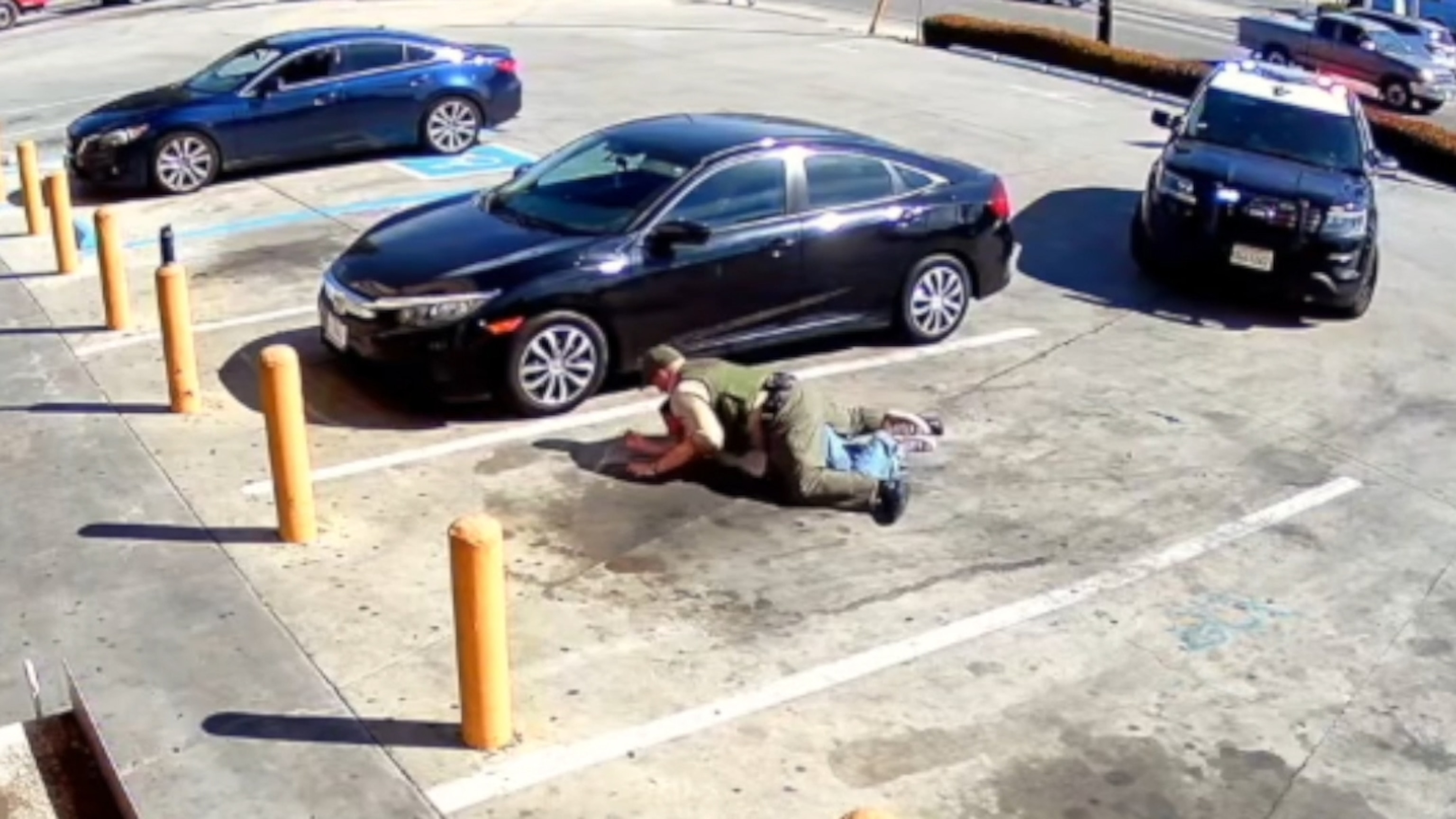 PHOTO: In surveillance footage released by transgender man Emmett Brock and his attorney, Brock is seen getting arrested by a Los Angeles County Sheriff's deputy.