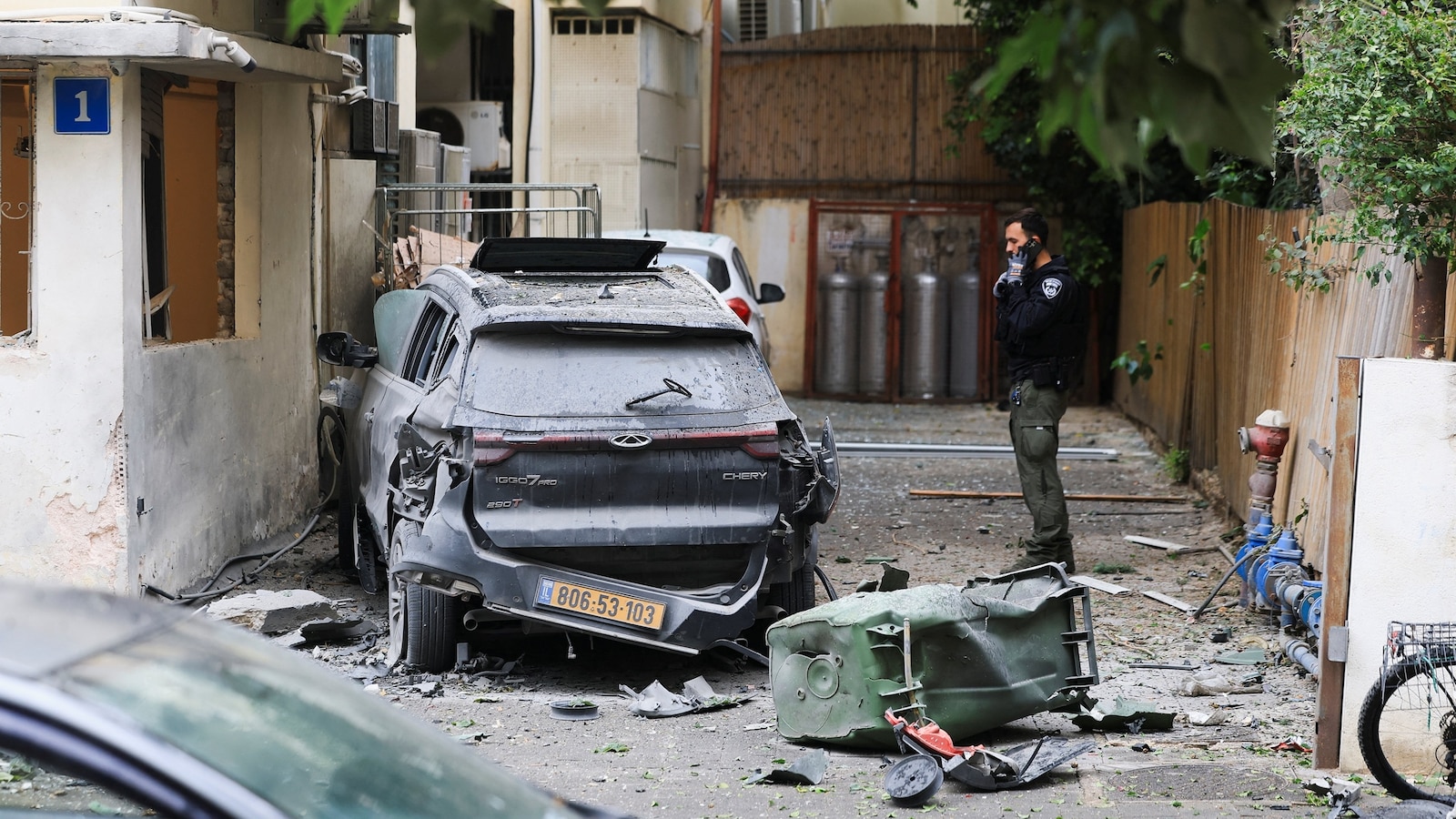 Iran live updates: Missile fire injures 14 people in Israel, emergency service says