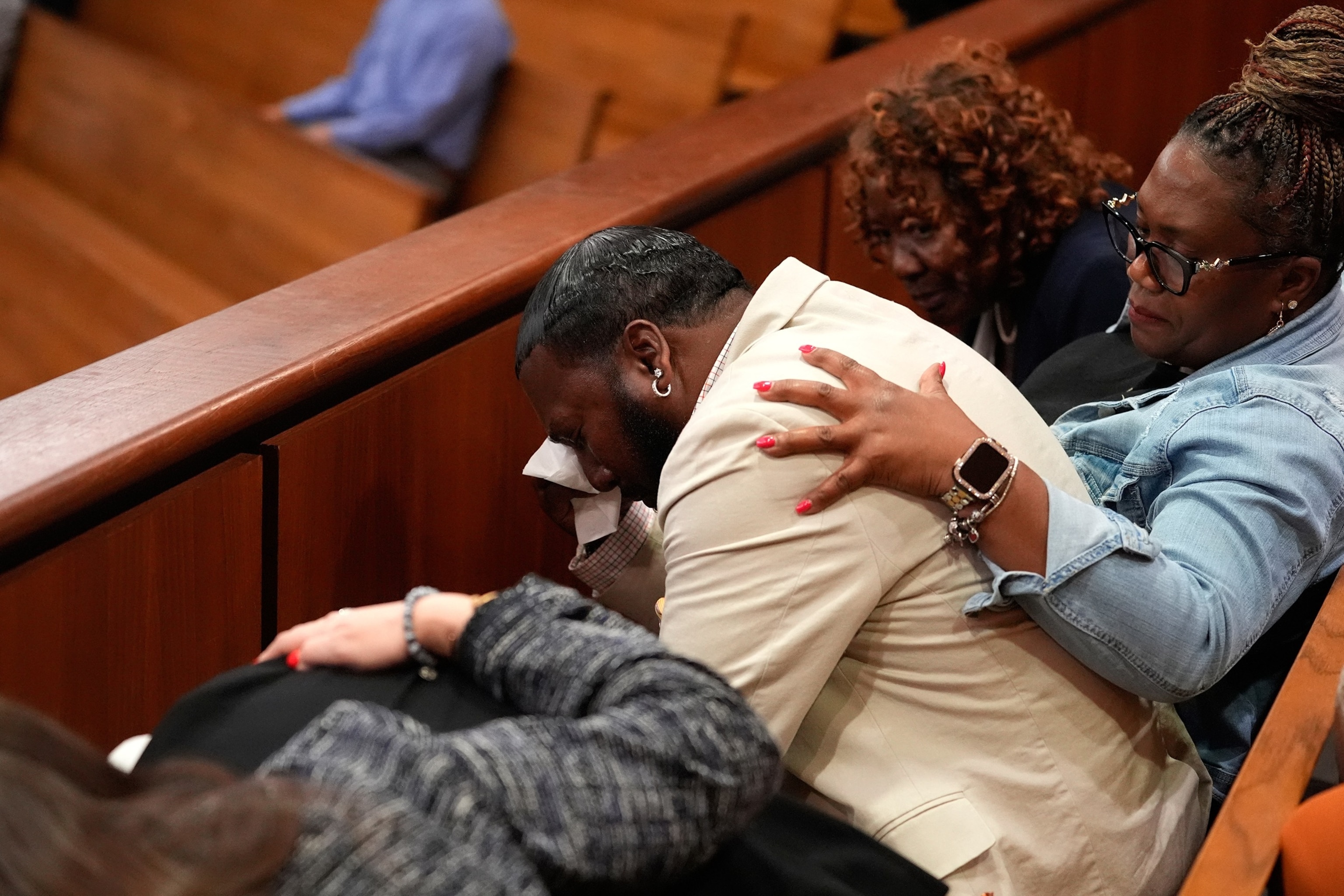 PHOTO: Troy Belton, center, father of Cyrus Carmack-Belton, reacts after a not guilty verdict against Chikei Rick Chow, accused in the 2023 fatal shooting of his 14-year-old son, during a murder trial, on June 1, 2026, in Columbia, S.C. 
