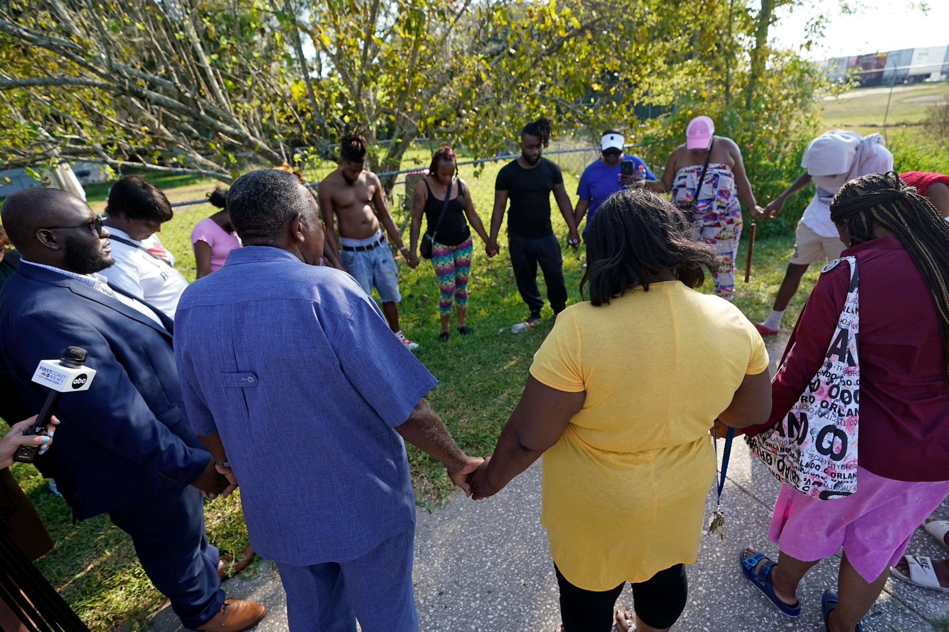 PHOTO: Residents gather for a prayer near the scene of a mass shooting Saturday, Aug. 26, 2023, in Jacksonville, Fla. (AP Photo/John Raoux)