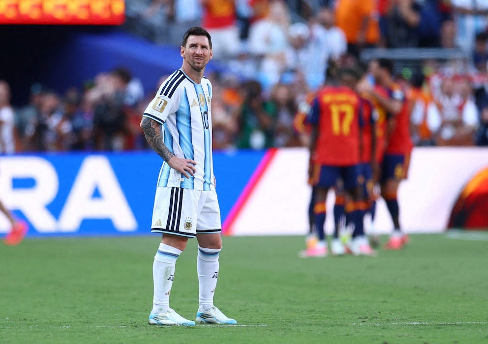 PHOTO: Argentina's Lionel Messi looks away as Spain players celebrate their first goal by Ferran Torres during the FIFA World Cup 2026 final match, July 19, 2026, in East Rutherford, New Jersey.