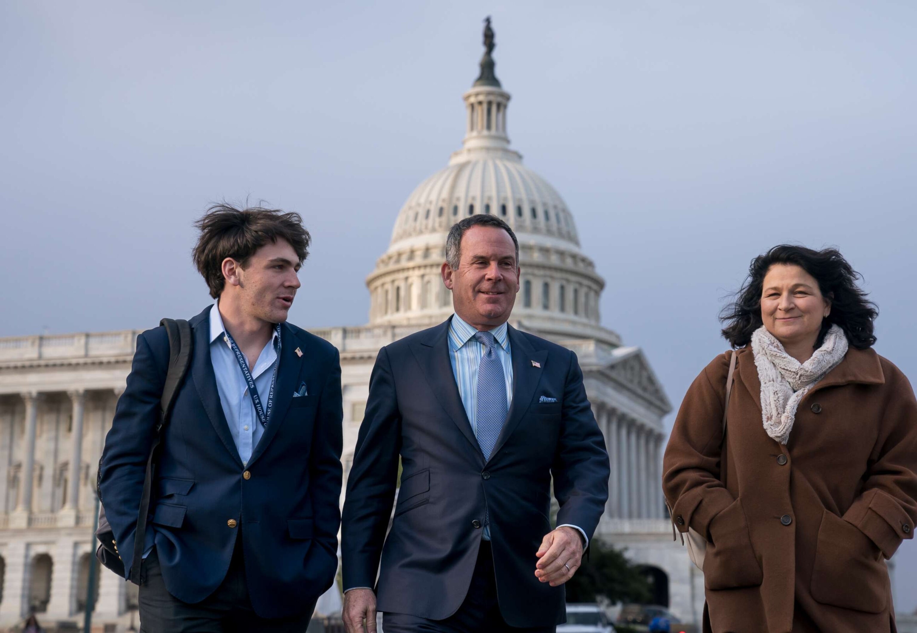 PHOTO: Adam Frisch of Aspen, Colo., center, the Democrat who opposed Rep. Lauren Boebert, R-Colo., in Colorado's 3rd Congressional District, walks with his son Felix Frisch, left, and wife Katy Frisch, right, at the Capitol, Nov. 18, 2022. 