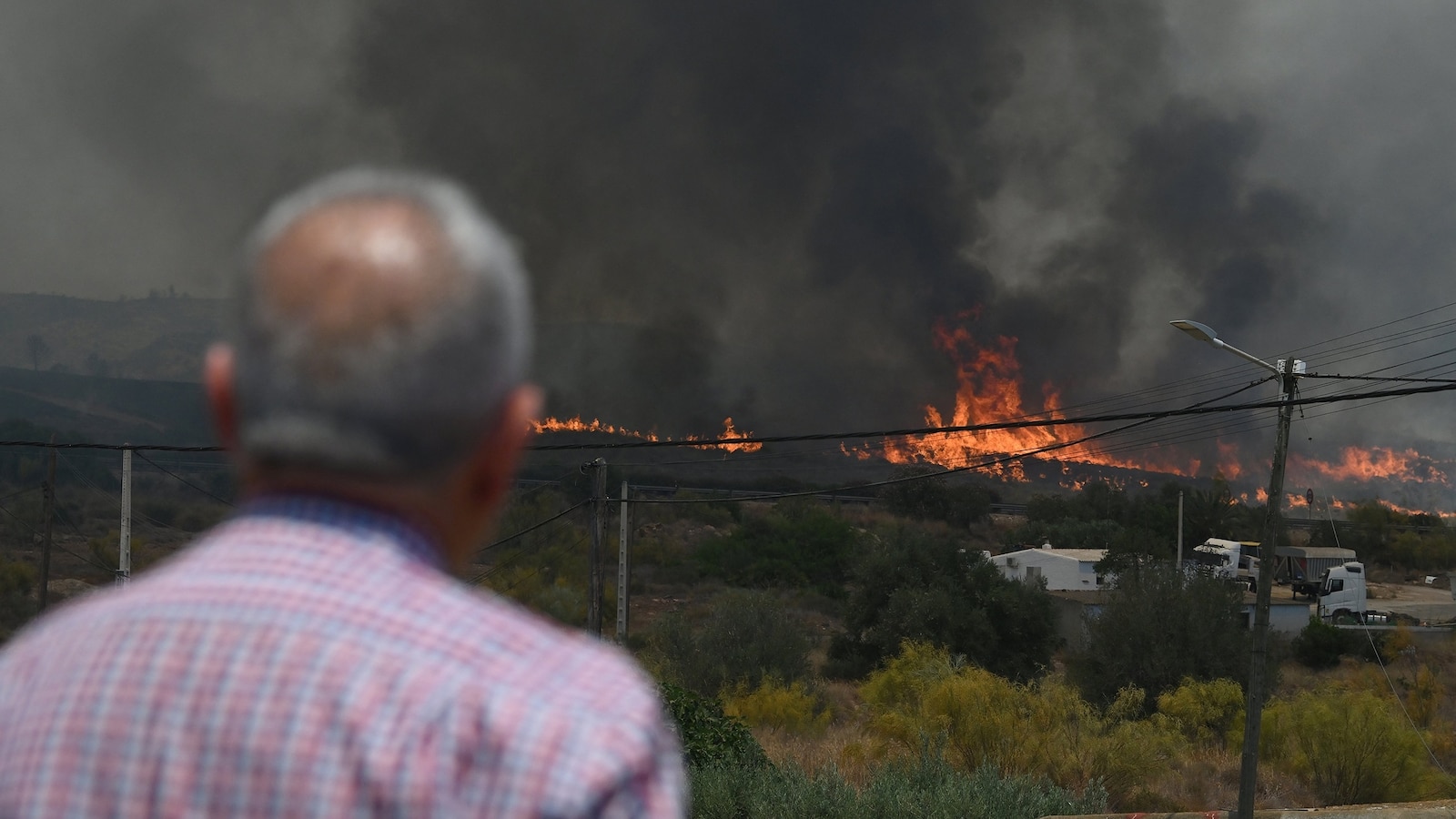 At least 12 dead, 23 missing amid fast-moving wildfire in southern Spain