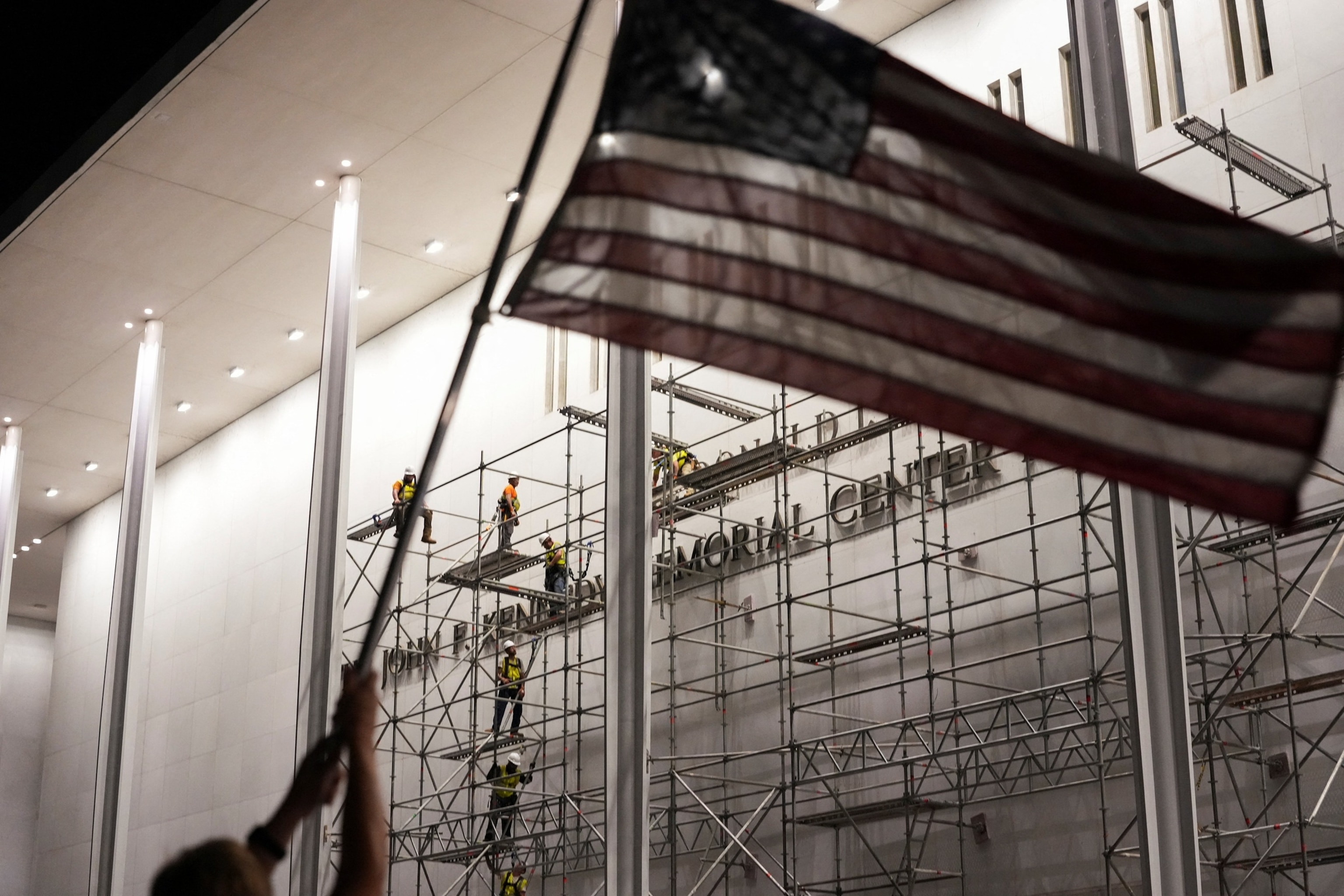 PHOTO: Lettering referencing U.S. President Donald Trump is removed from the facade of the John F. Kennedy Center for the Performing Arts, in Washington