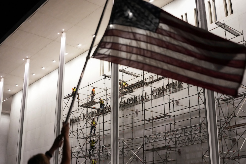 PHOTO: Lettering referencing U.S. President Donald Trump is removed from the facade of the John F. Kennedy Center for the Performing Arts, in Washington