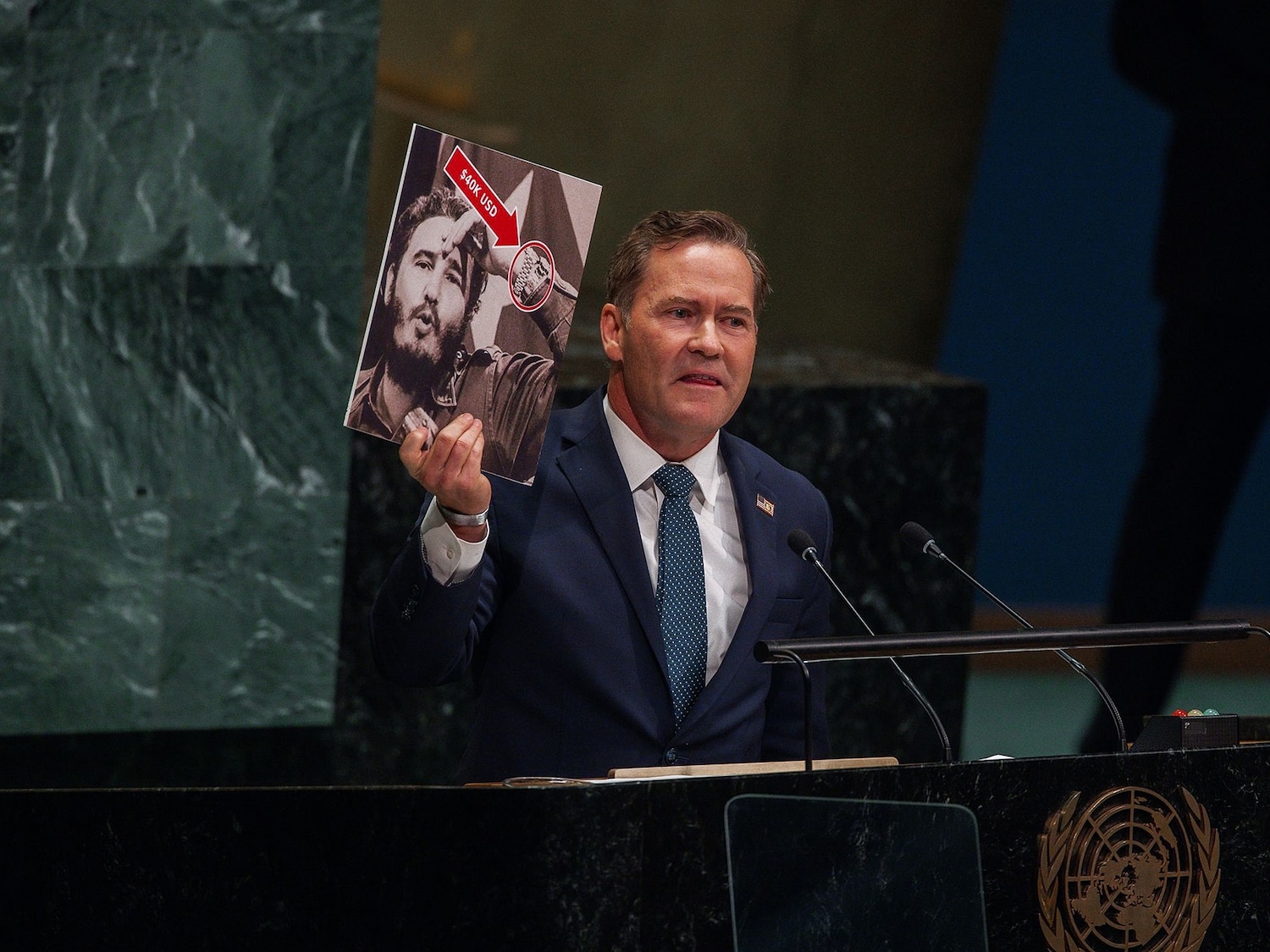 Representative to the United Nations Michael Waltz holds up a