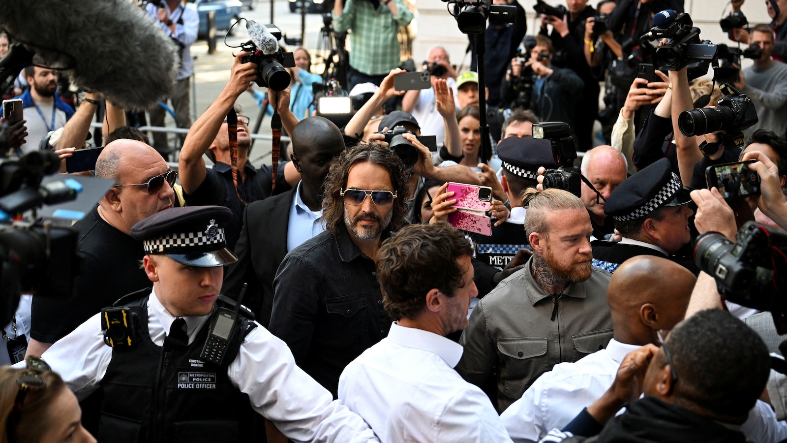 Russel Raper Russell Brand posts bail on rape and sexual assault charges in chaotic ...