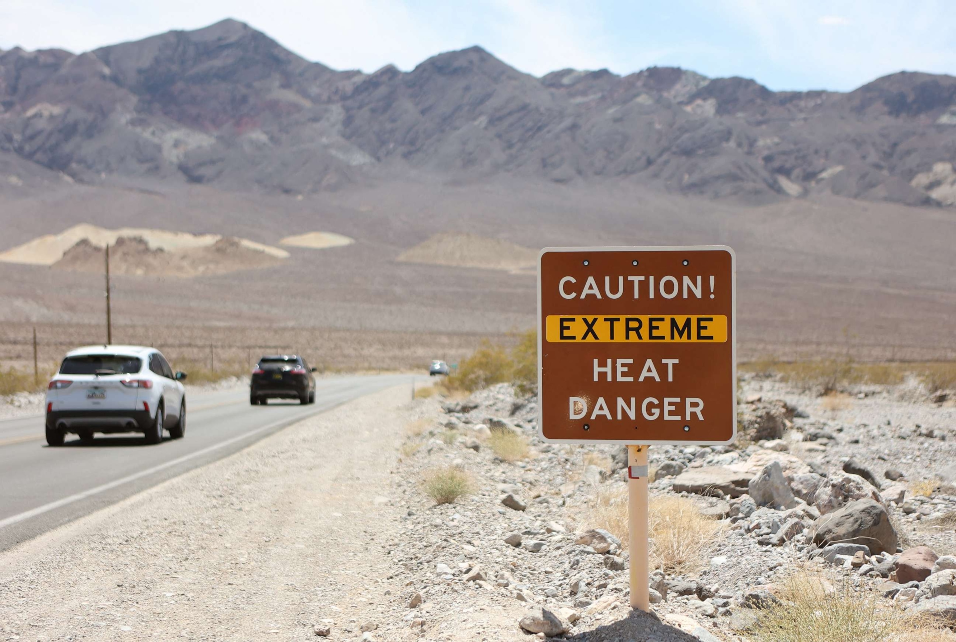 PHOTO: A heat advisory sign is shown along US highway 190 during a heat wave in Death Valley National Park, July 16, 2023, in Death Valley, Calif.