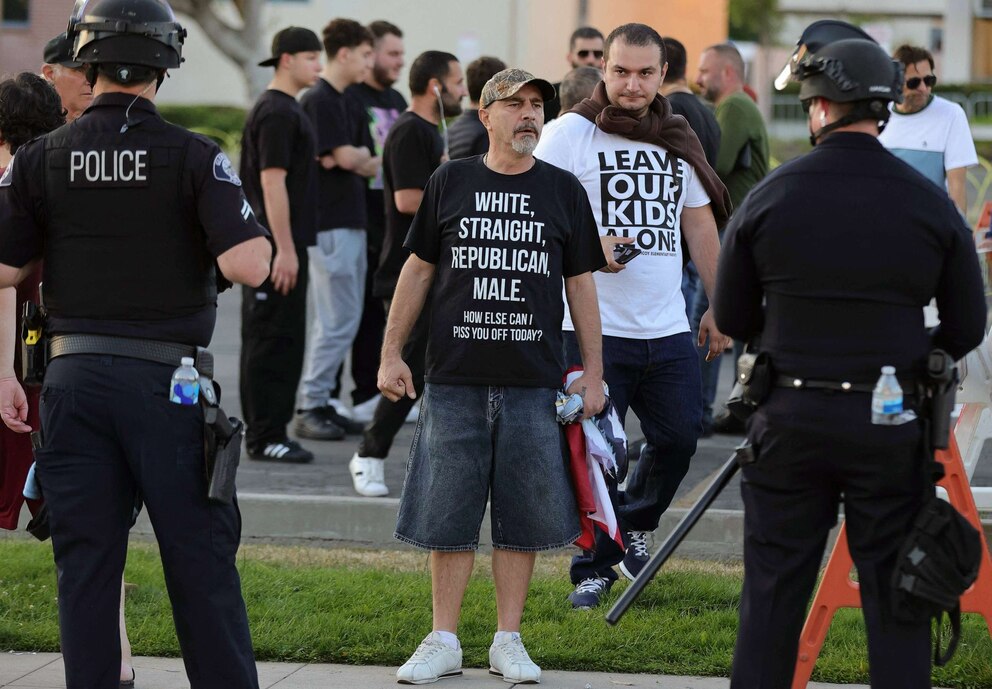 PHOTO: Police keep watch as protesters gather outside the Glendale Unified School District headquarters in Glendale, Calif., June 20, 2023.
