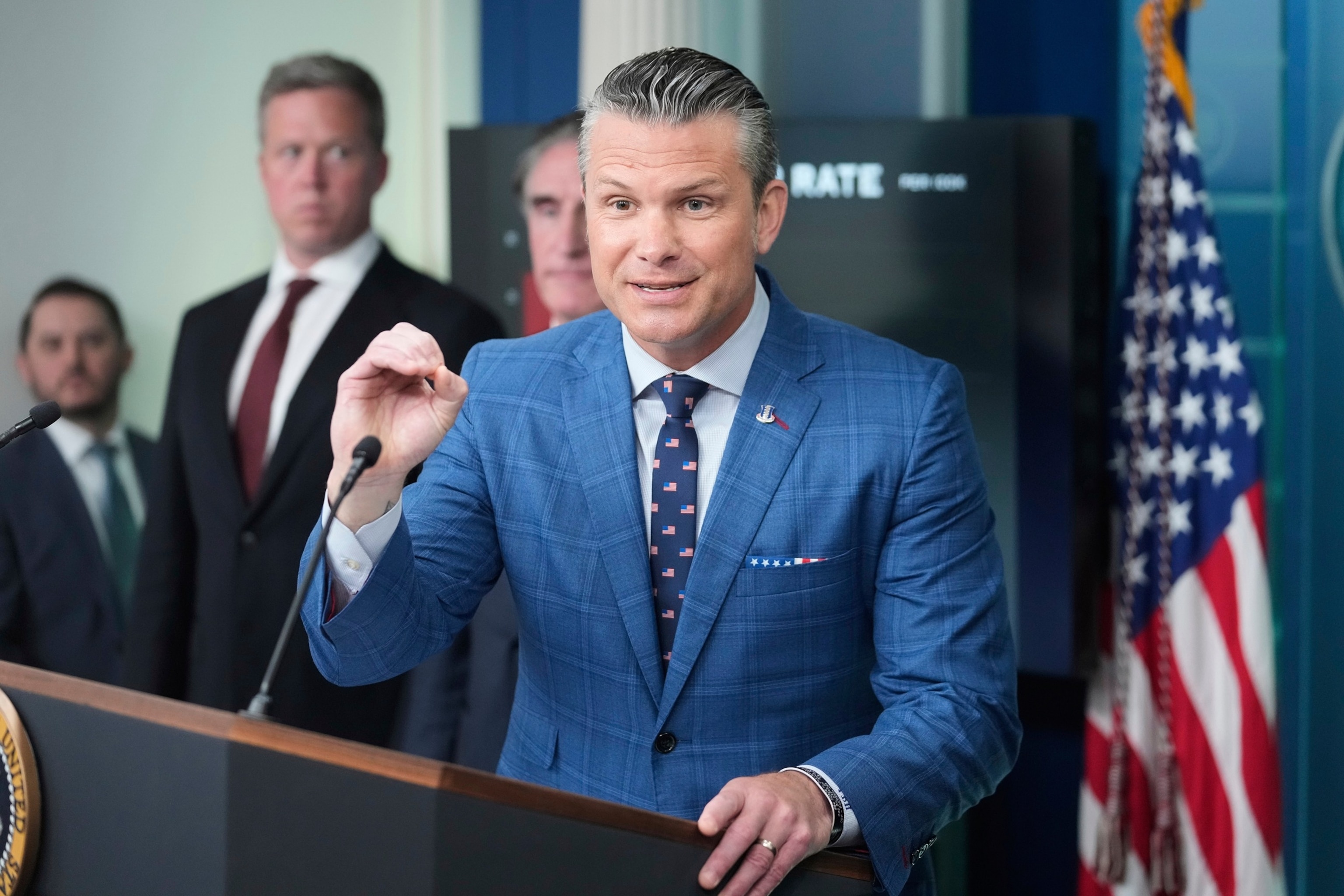 PHOTO: Defense Secretary Pete Hegseth speaks as Interior Secretary Doug Burgum and Army Secretary Dan Driscoll listen during a press briefing with President Donald Trump at the White House, Aug. 11, 2025, in Washington.